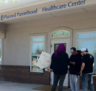 Lauren counseling the boyfriends of women inside Planned Parenthood