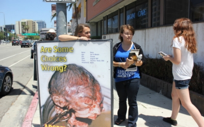  Claire Miller, left, during a daylong demonstration as part of ProLife Training Camp. Timothy Bella/America Tonight