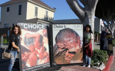 Campers demonstrate outside a Planned Parenthood center in Whittier, California. Timothy Bella/America Tonight