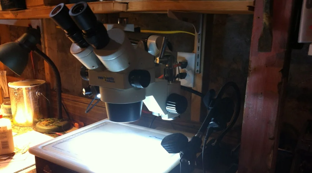 The microscope in use with my head lamps from my bike. 