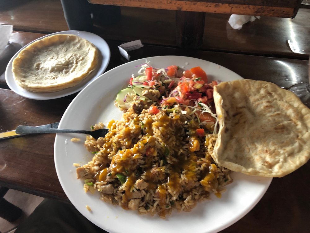  Rice with chicken and hand made corn tortilla. 