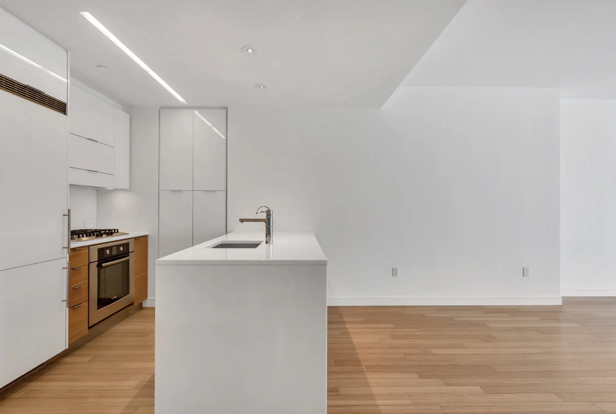 All kitchen counters are made with crystal white polished glass and custom bamboo cabinetry. State of the art appliances include a Bosch dishwasher, oven and cook top, and a Liebherr Refridgerator. 