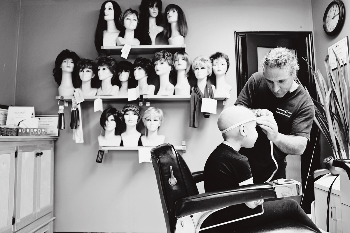 Des getting fitted for a wig