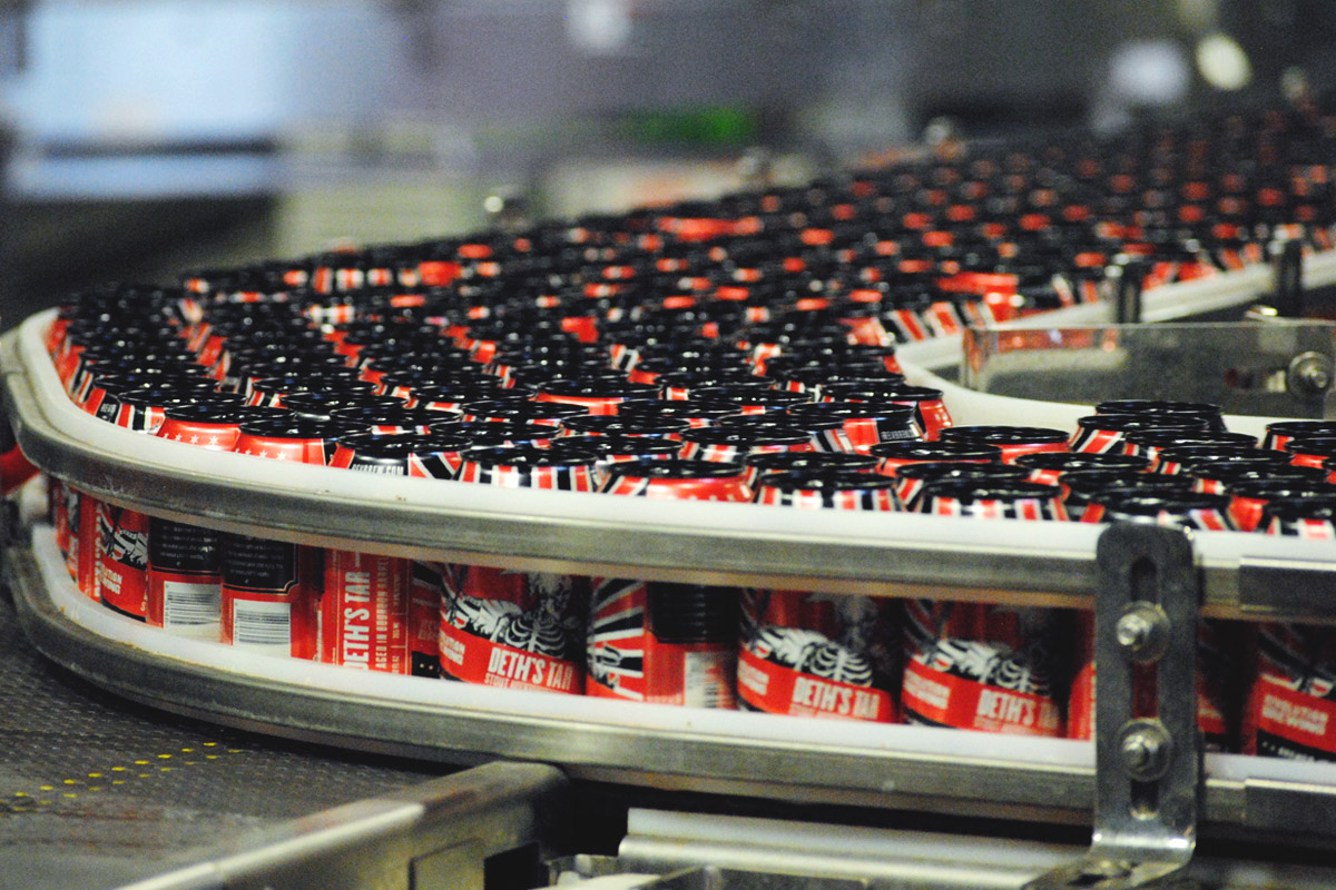   Thousands of  Deth's Tar  cans make their way down the new canning line at Revolution's Kedzie brewery.  