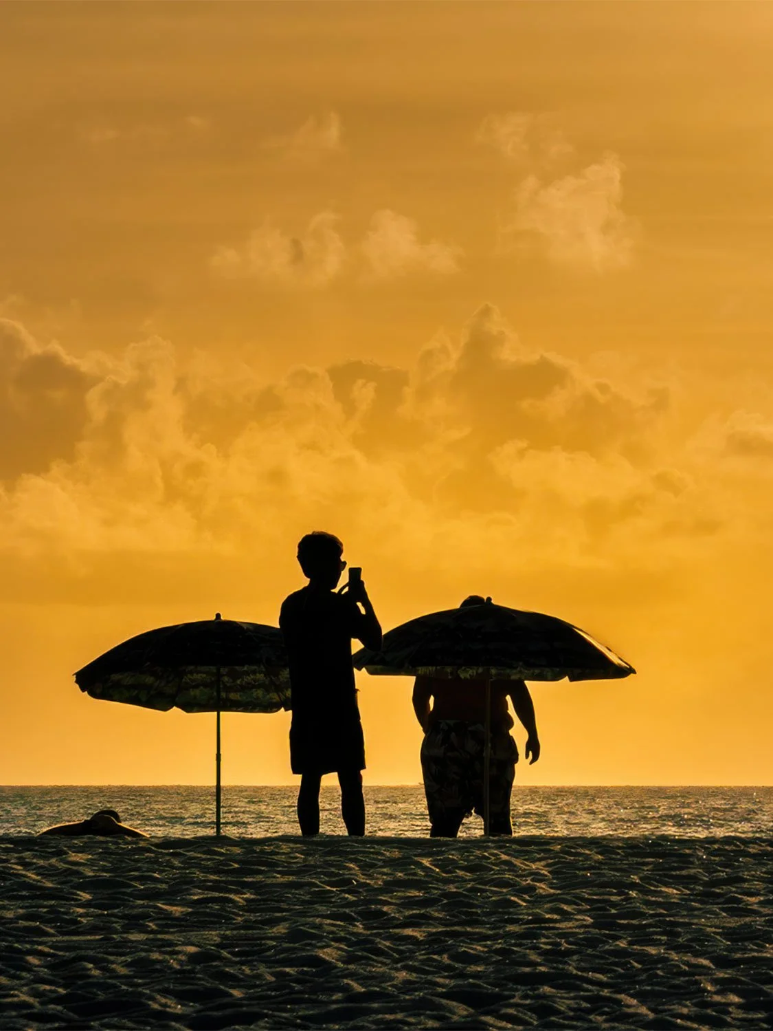 South Beach sunrise silhouette beach umbrellas golden sky ocean photography Miami beach morning