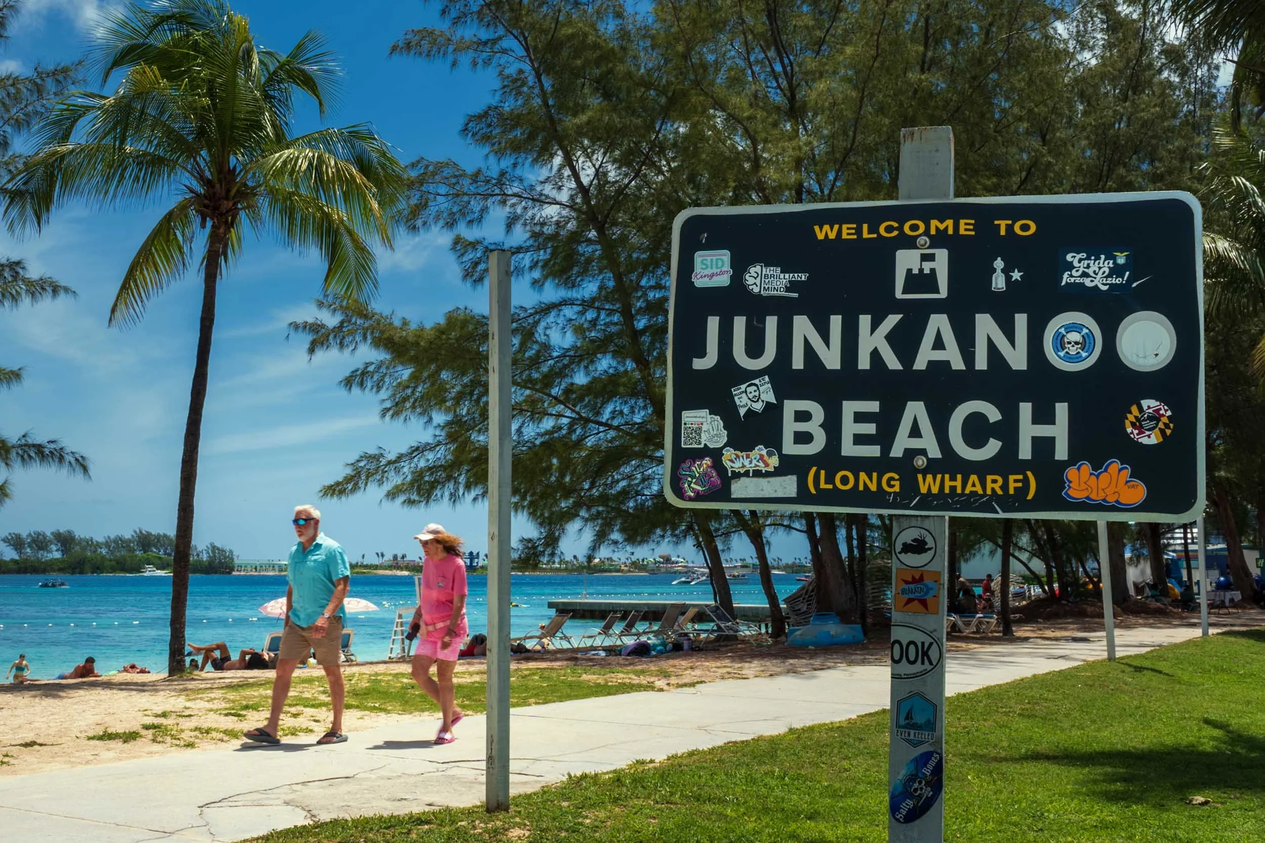 Junkanoo Beach Nassau Bahamas sign tourists palm trees crystal blue water Caribbean travel destination