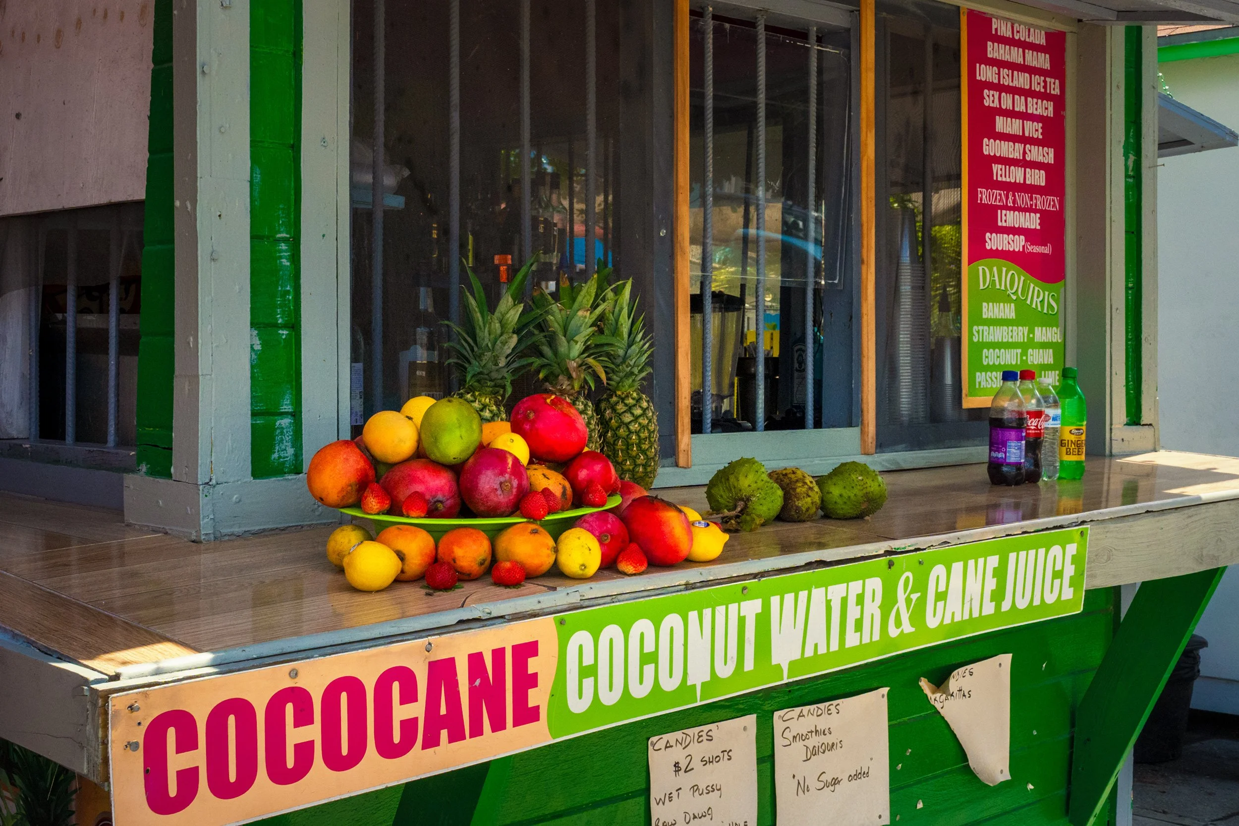 Coconut water and cane juice bar Nassau Bahamas with fresh tropical fruit, daiquiris, and Caribbean cocktail menu.