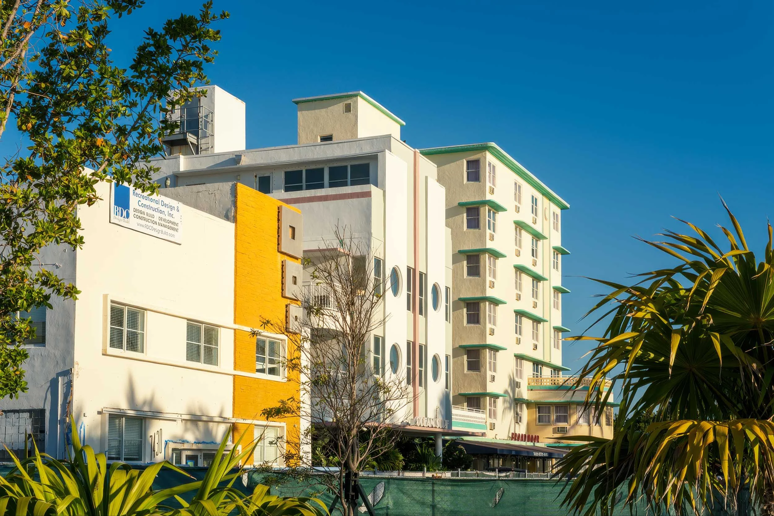 Wide streetscape view of Ocean Terrace in North Beach Miami showing RDC construction banner and hotel signage down the block