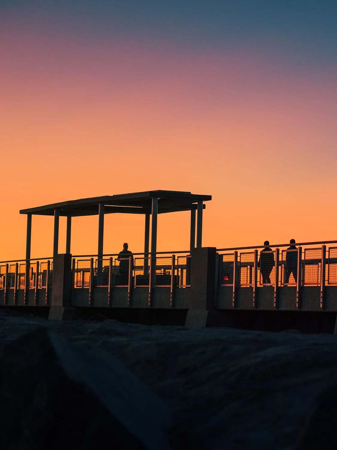 Kameron Brothers shooting sunrise at South Pointe Pier in South Beach as light spreads across the horizon.