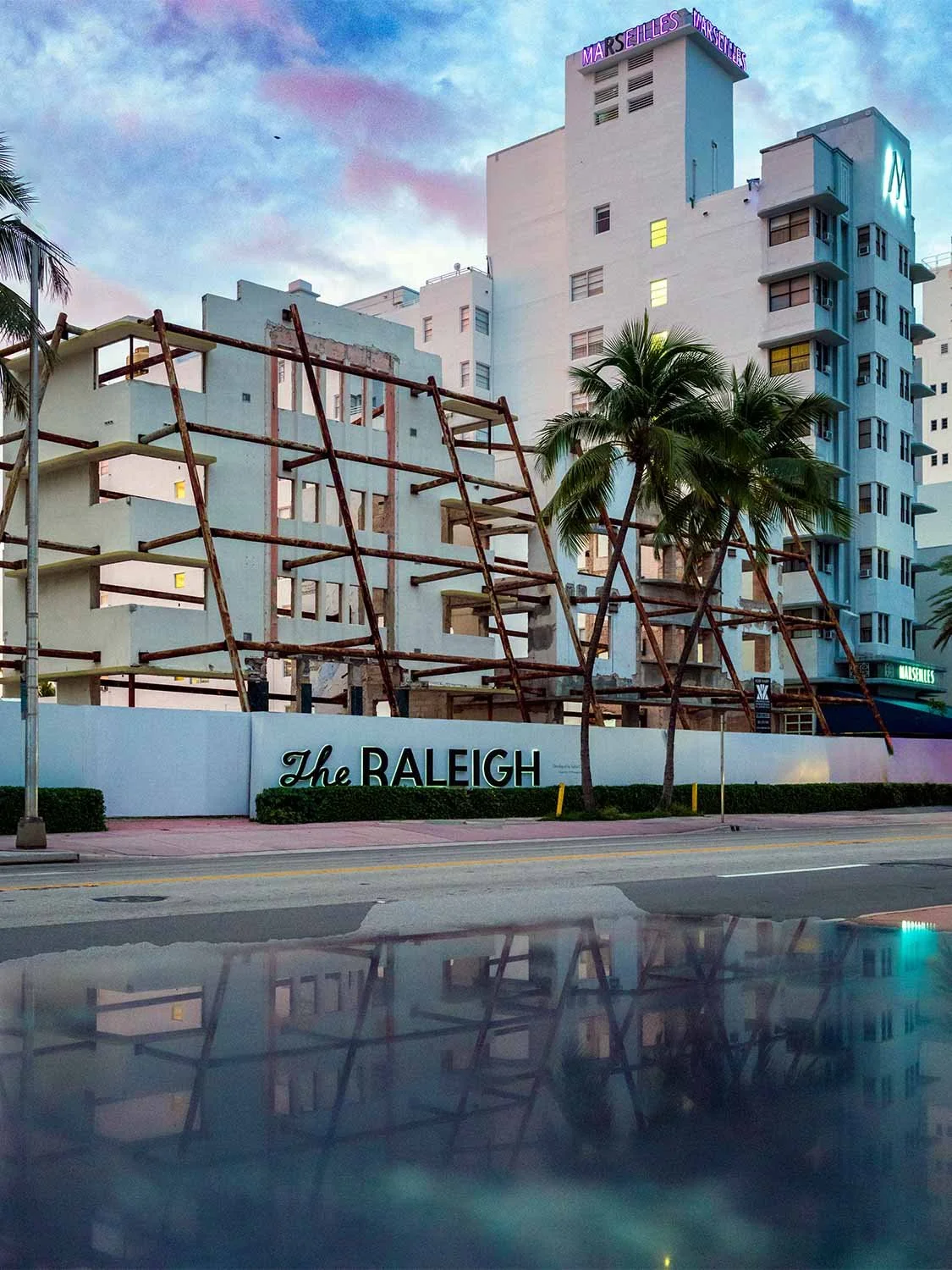 The Raleigh South Beach hotel renovation scaffolding Miami Beach Art Deco district sunset reflection