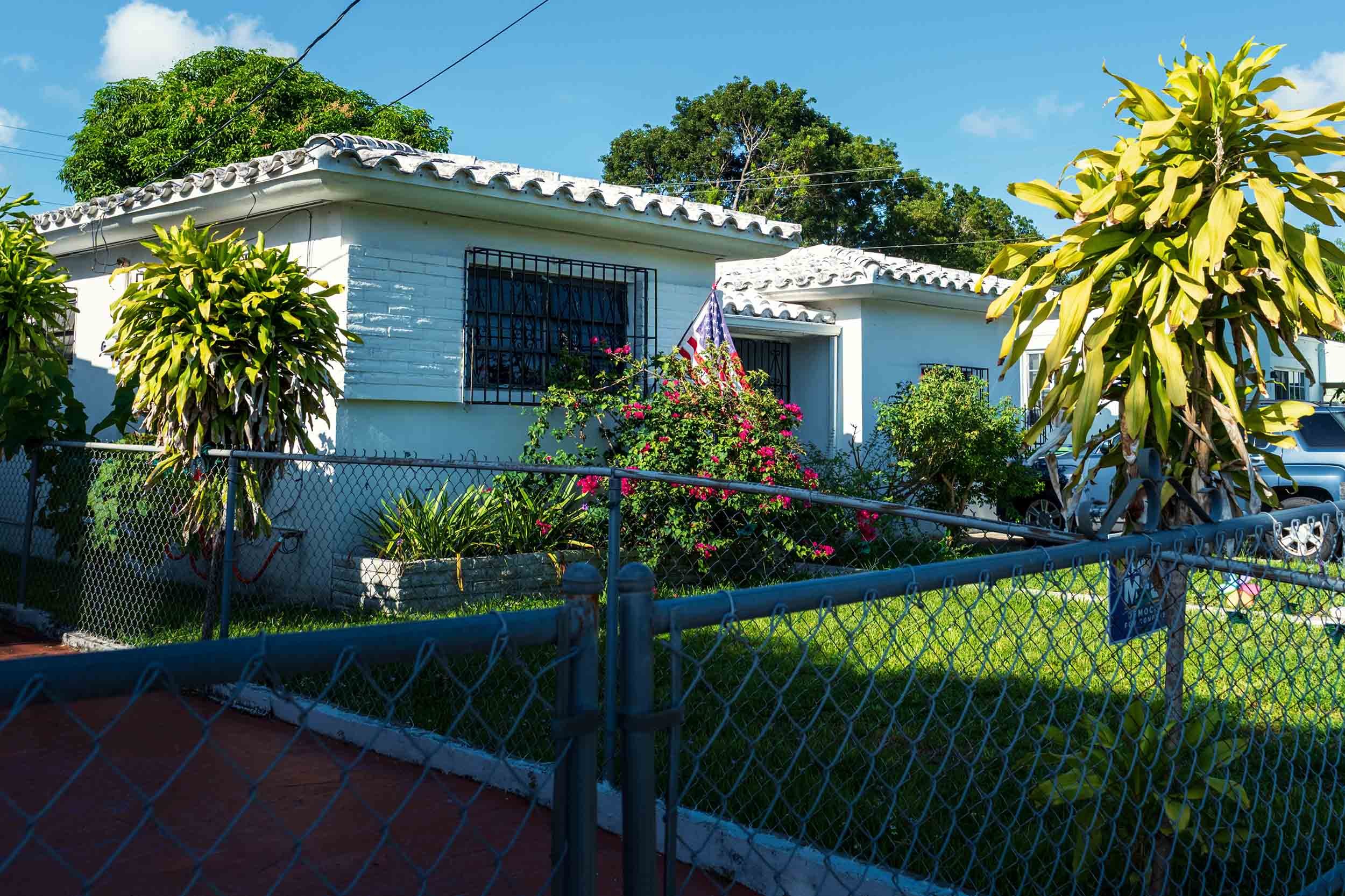 Spanish tile-roof home with tropical landscaping, Buena Vista Miami