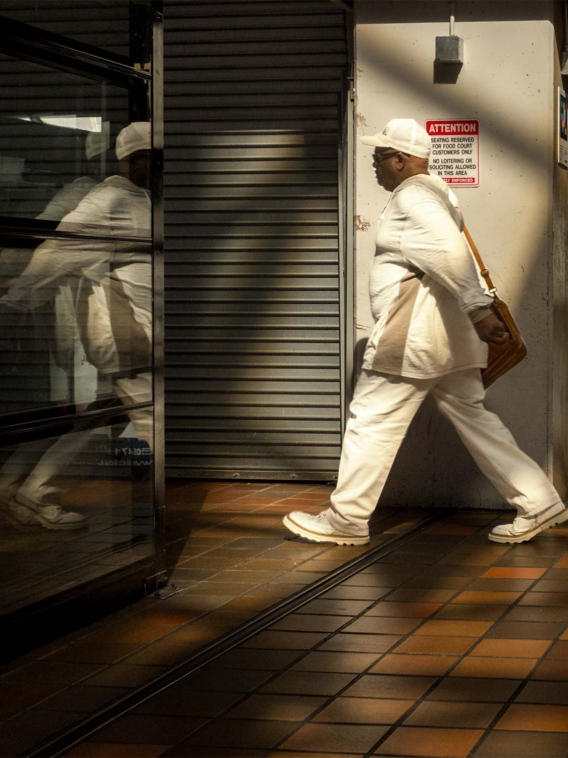 Downtown Miami street photography man white outfit reflection glass urban candid indoor natural light