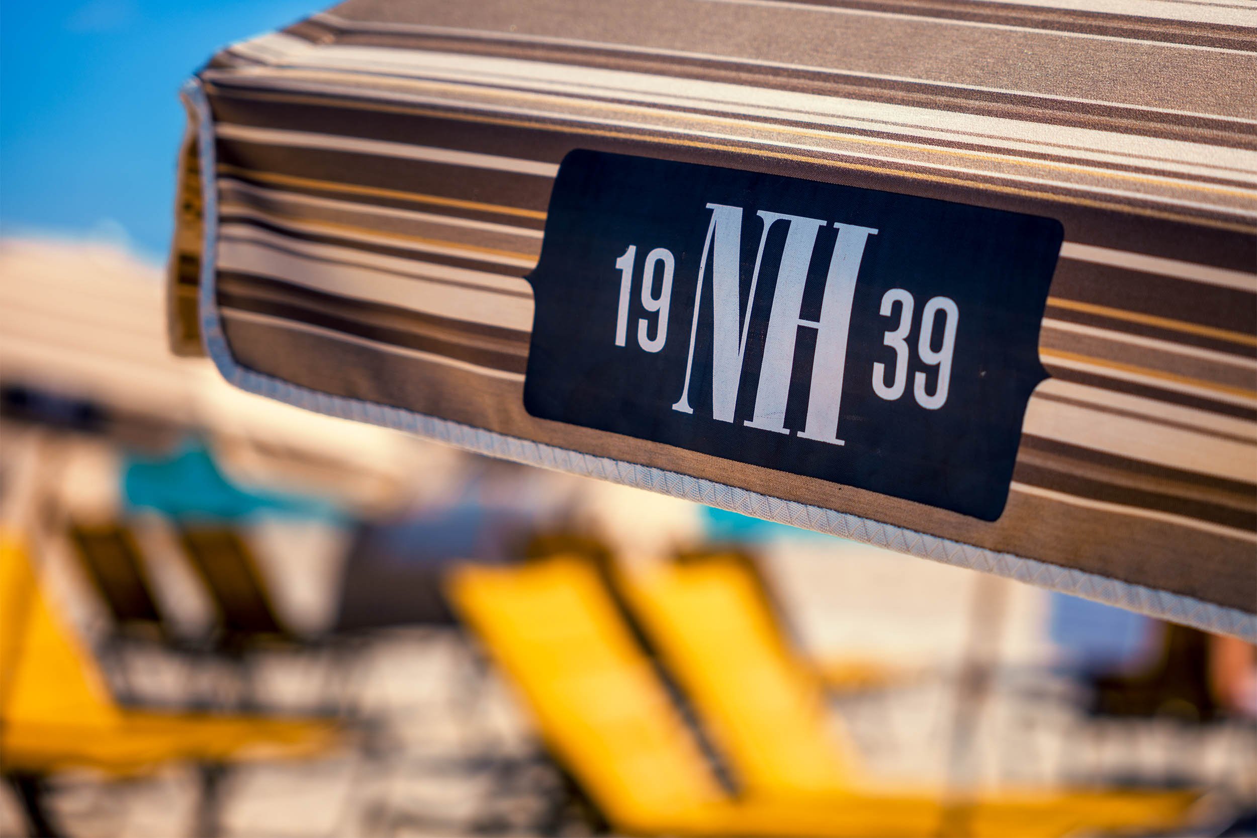 Another beautiful day on South Beach in Miami Beach with the beach chairs and sun umbrellas ready to use