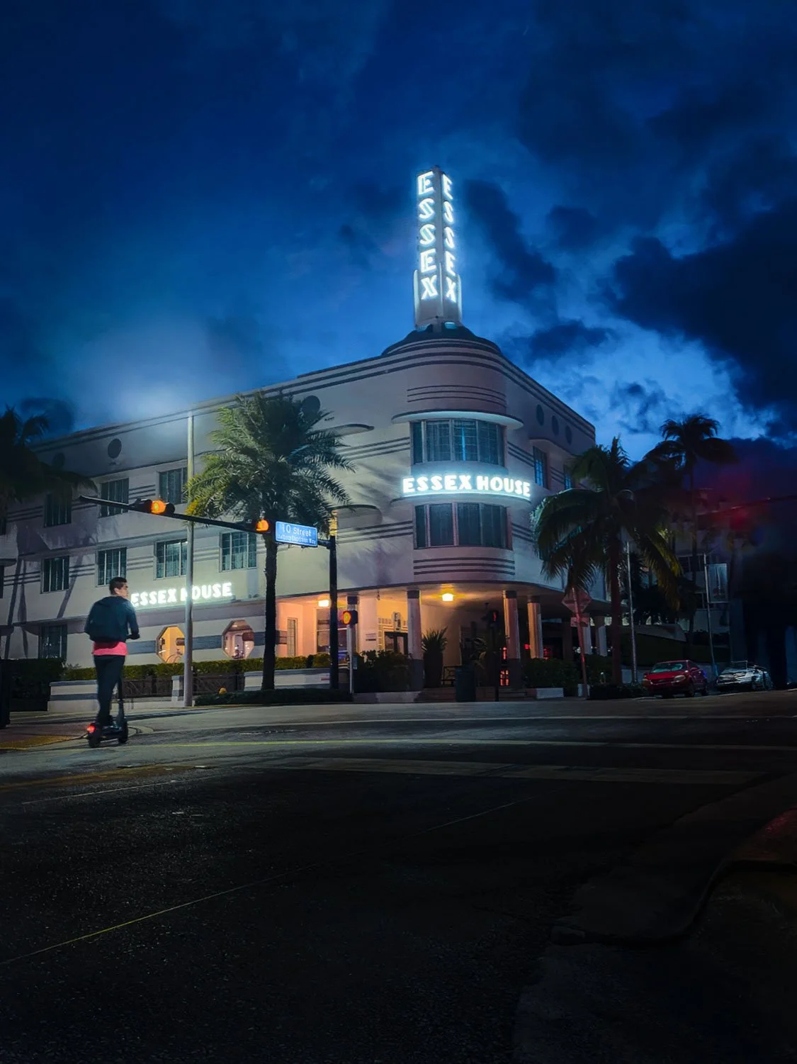 The Essex Art Deco Hotel on Collins Avenue in South Beach Miami at sunrise, featuring pastel colors and classic Art Deco architecture.