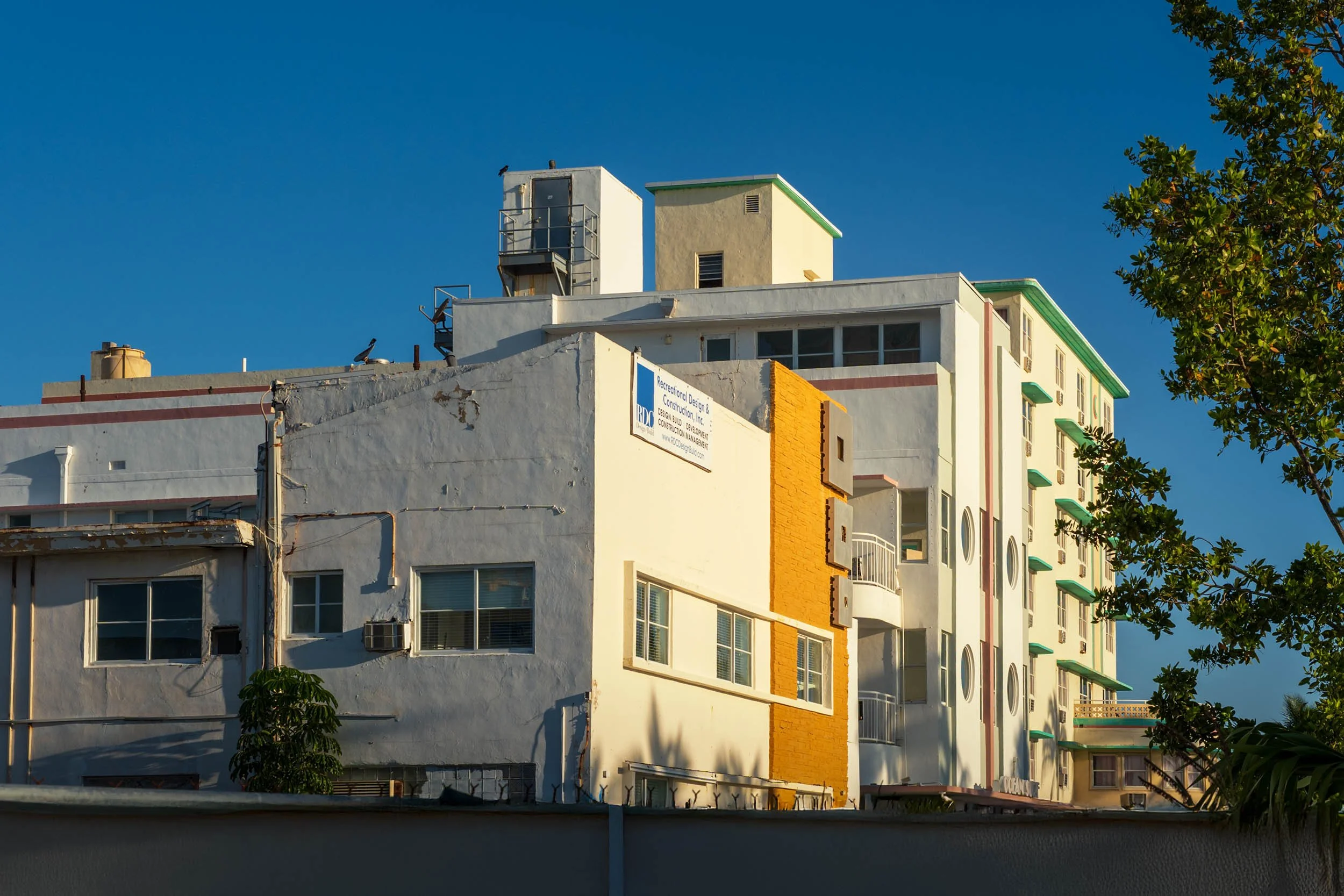 Rooftop-level view of the Ocean Terrace block with construction signage, North Beach Miami