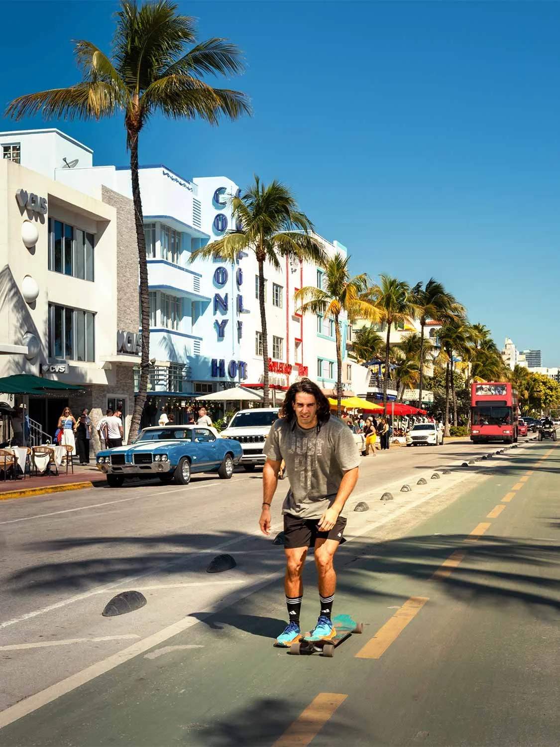 skateboarding Ocean Drive Miami Beach Art Deco district Colony Hotel palm trees sunny day lifestyle