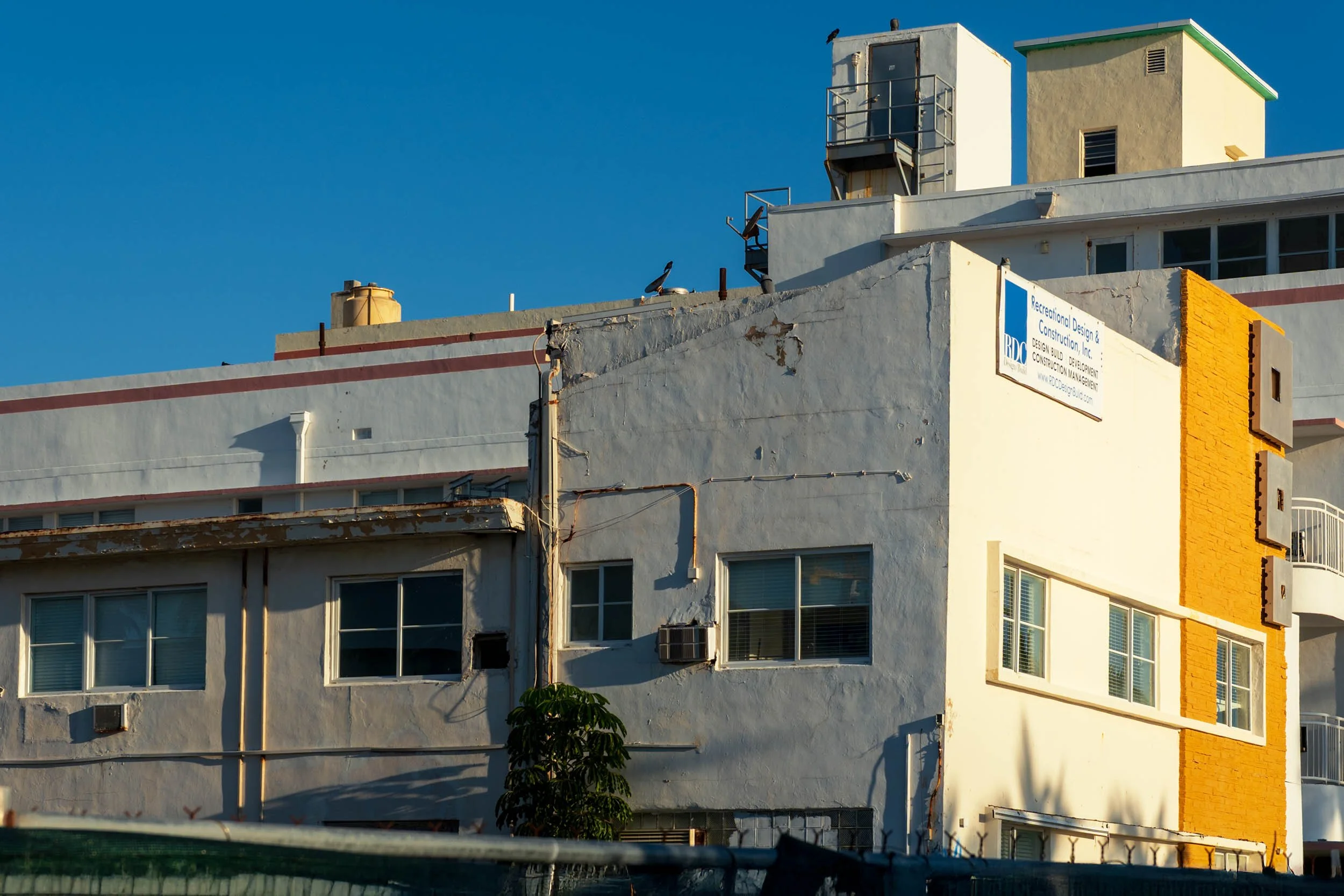 Rooftop mechanical structures and RDC construction banner above the Ocean Way Hotel, North Beach