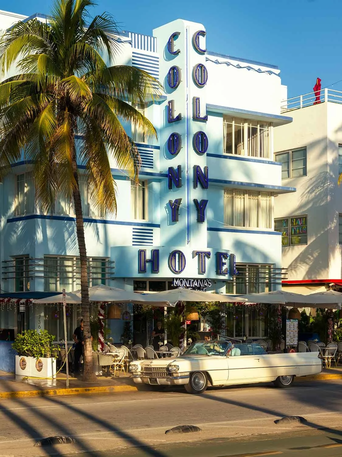 Colony Hotel Miami Beach Art Deco Ocean Drive vintage Cadillac convertible South Beach travel destination landmark
