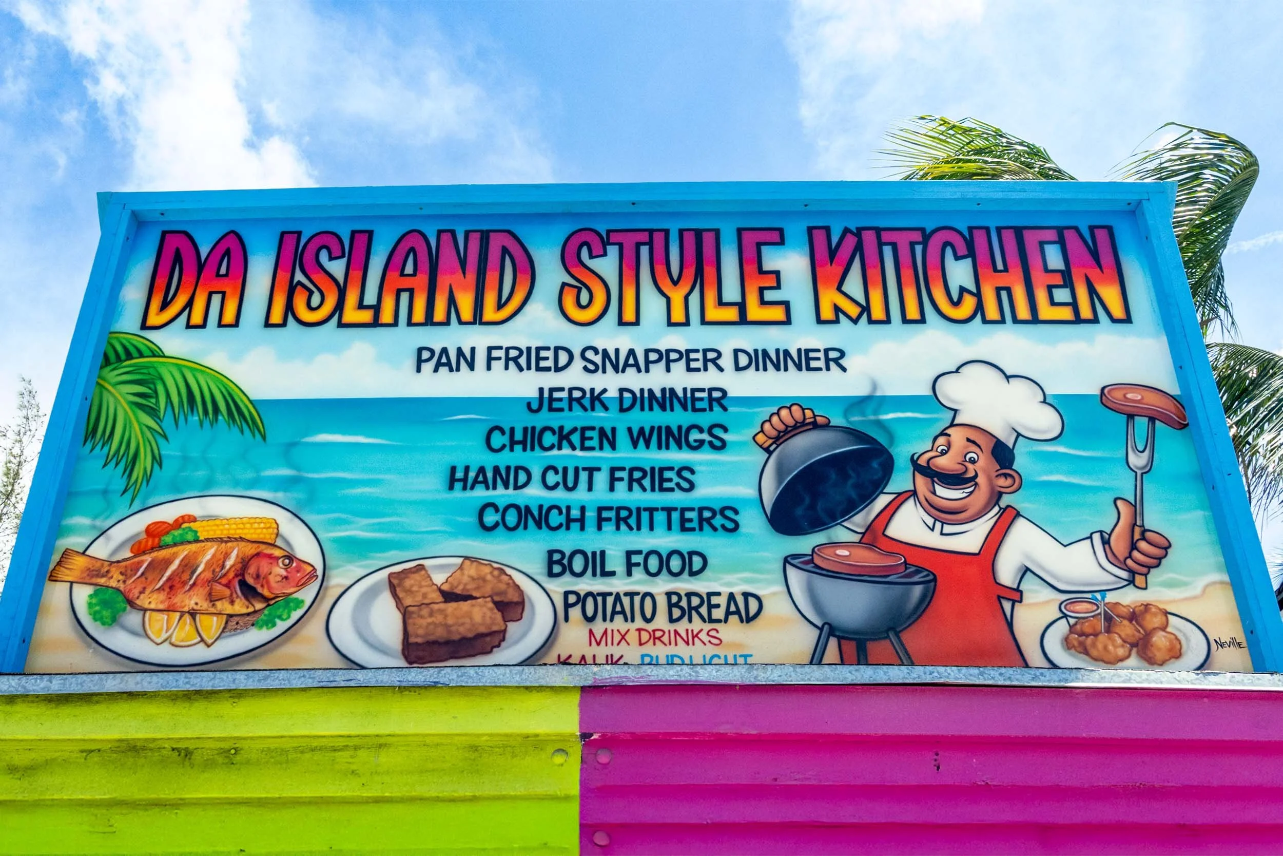 Island style Caribbean restaurant sign: pan fried snapper, jerk dinner, conch fritters, chicken wings, Bahamas food