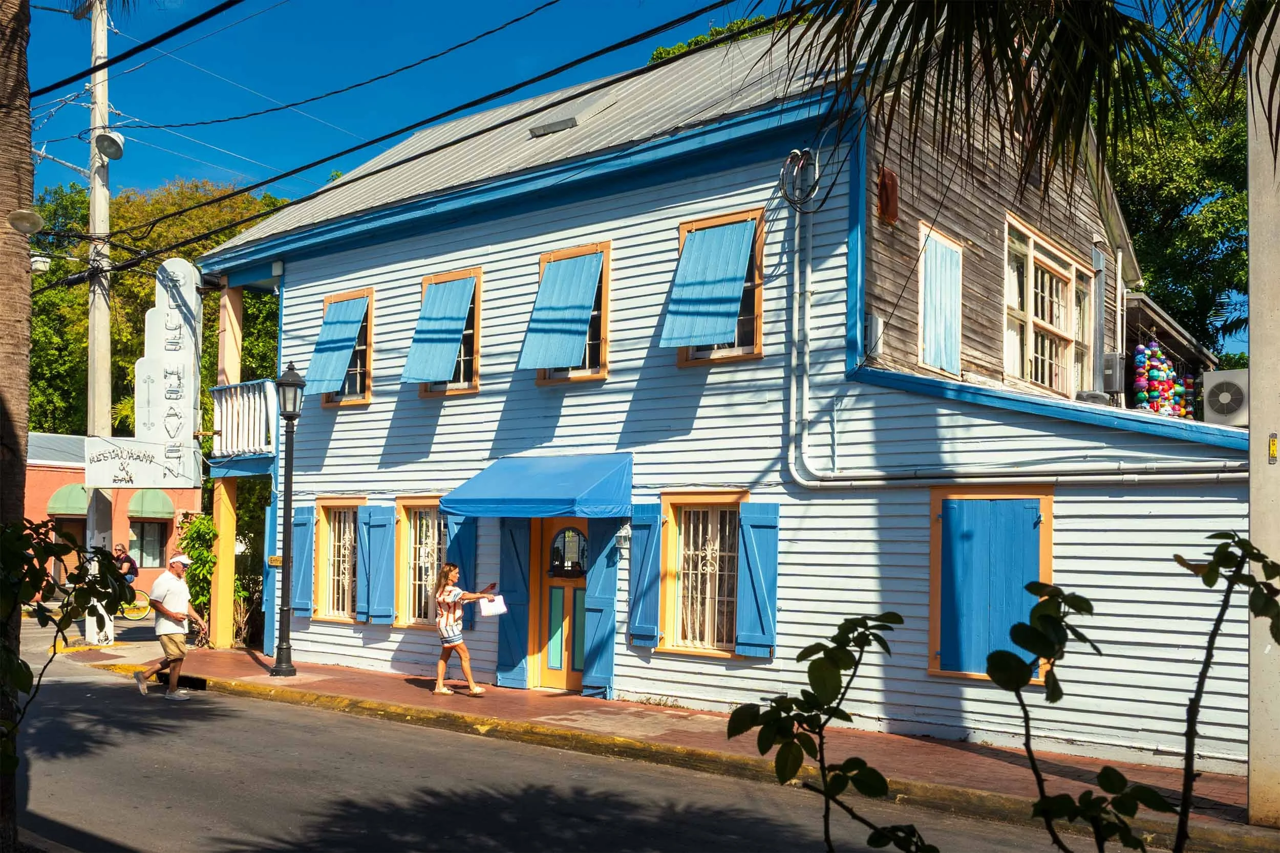 Key West historic architecture blue wooden building Old Town street colorful shutters tropical tourism Florida Keys