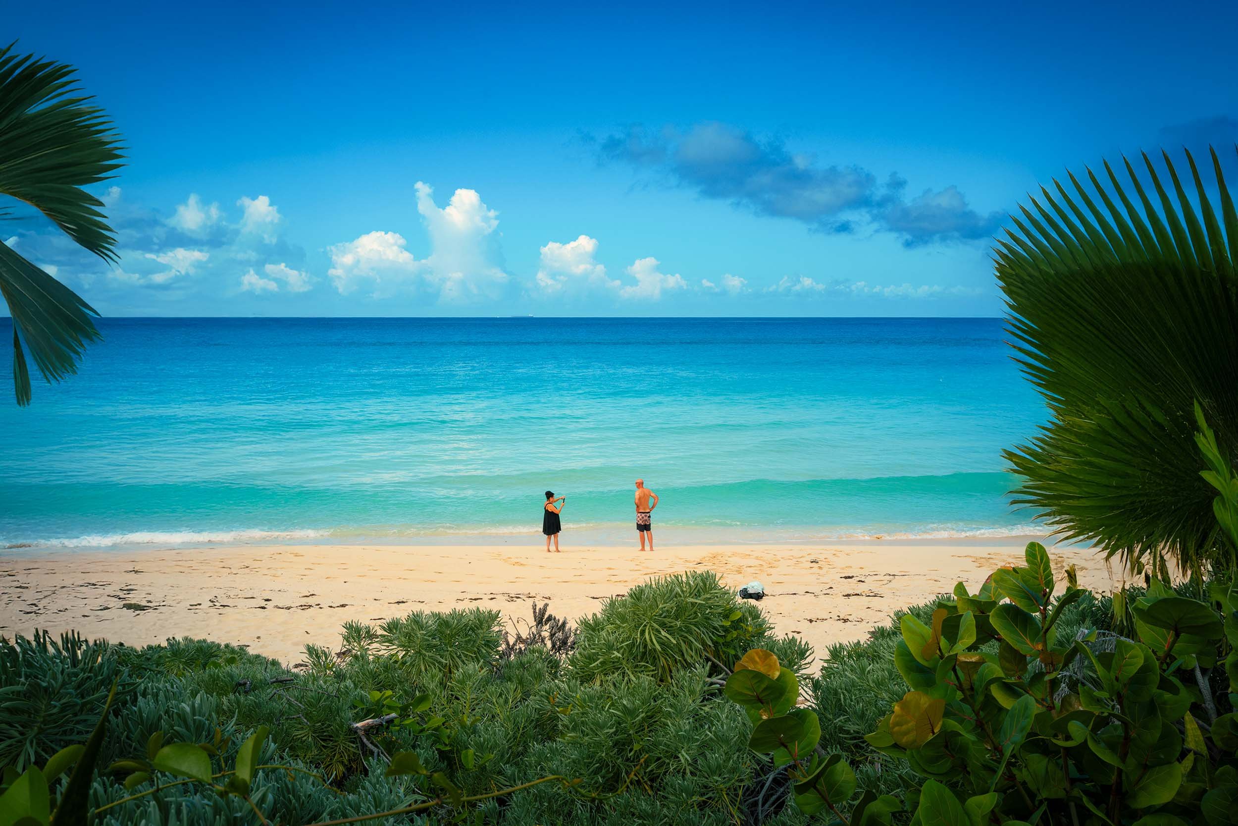 A couple from the Celebrity Summit enjoying a beautiful beach in Bimini Bahamas