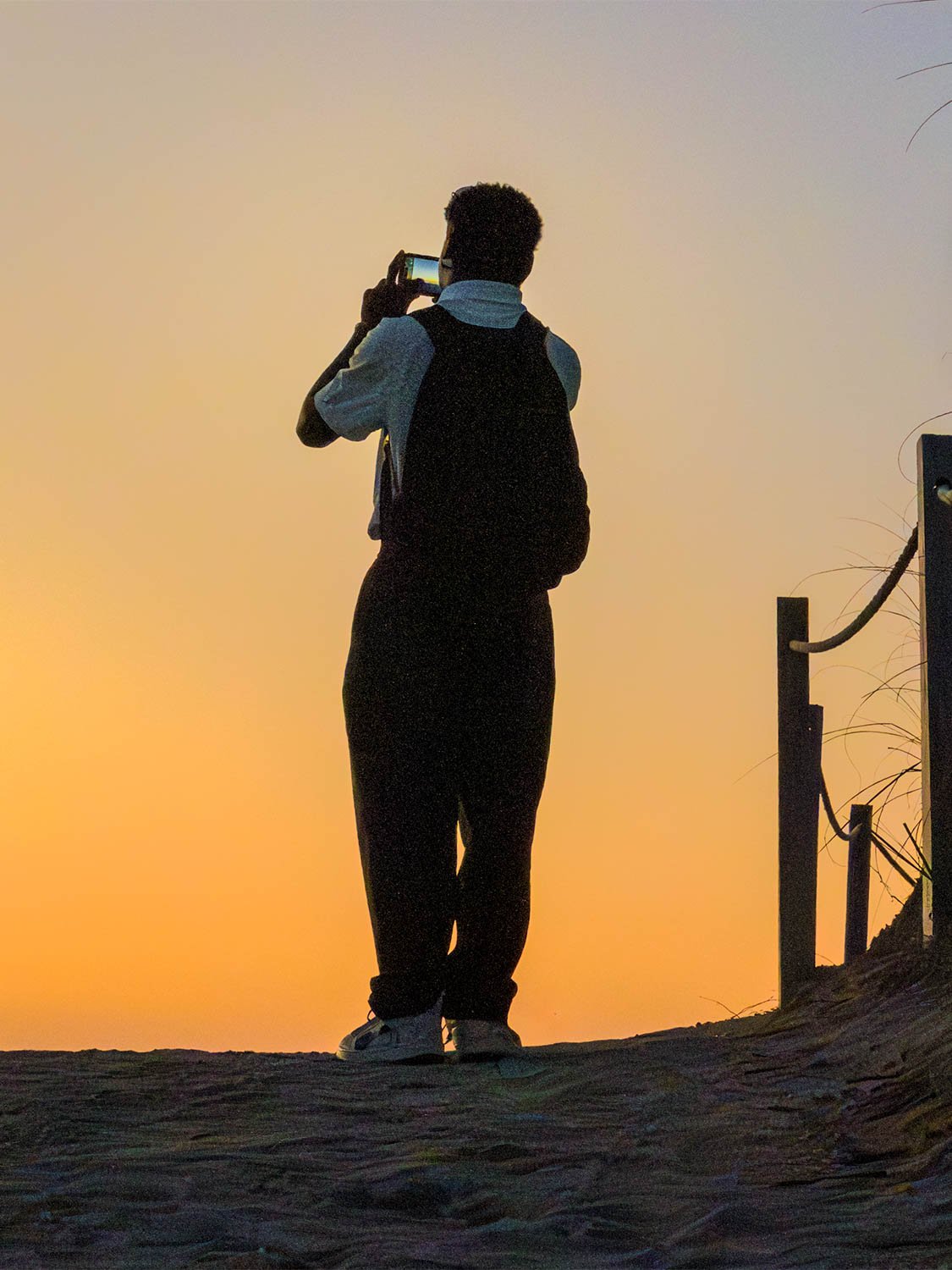 South Beach sunrise silhouette photography golden hour beach sand dunes traveler capturing sunset landscape.