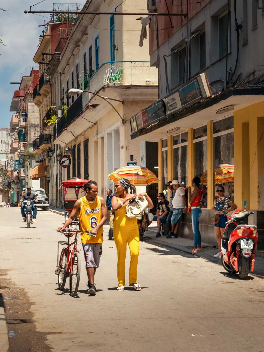 Street photography in Old Havana Cuba - A couple walking down the street