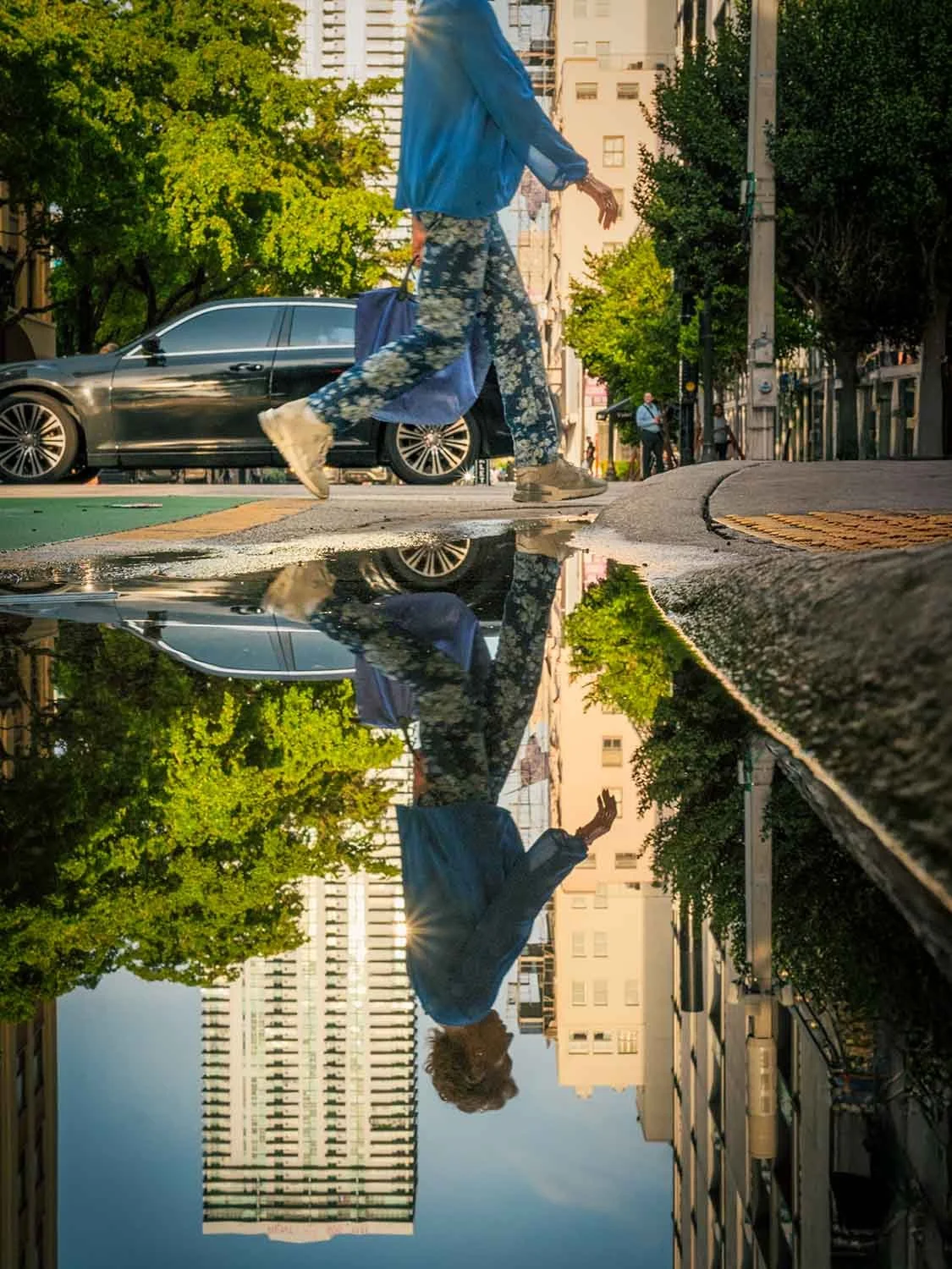 Stepping over a puddle in downtown Miami - Street photographer Kameron Brothers