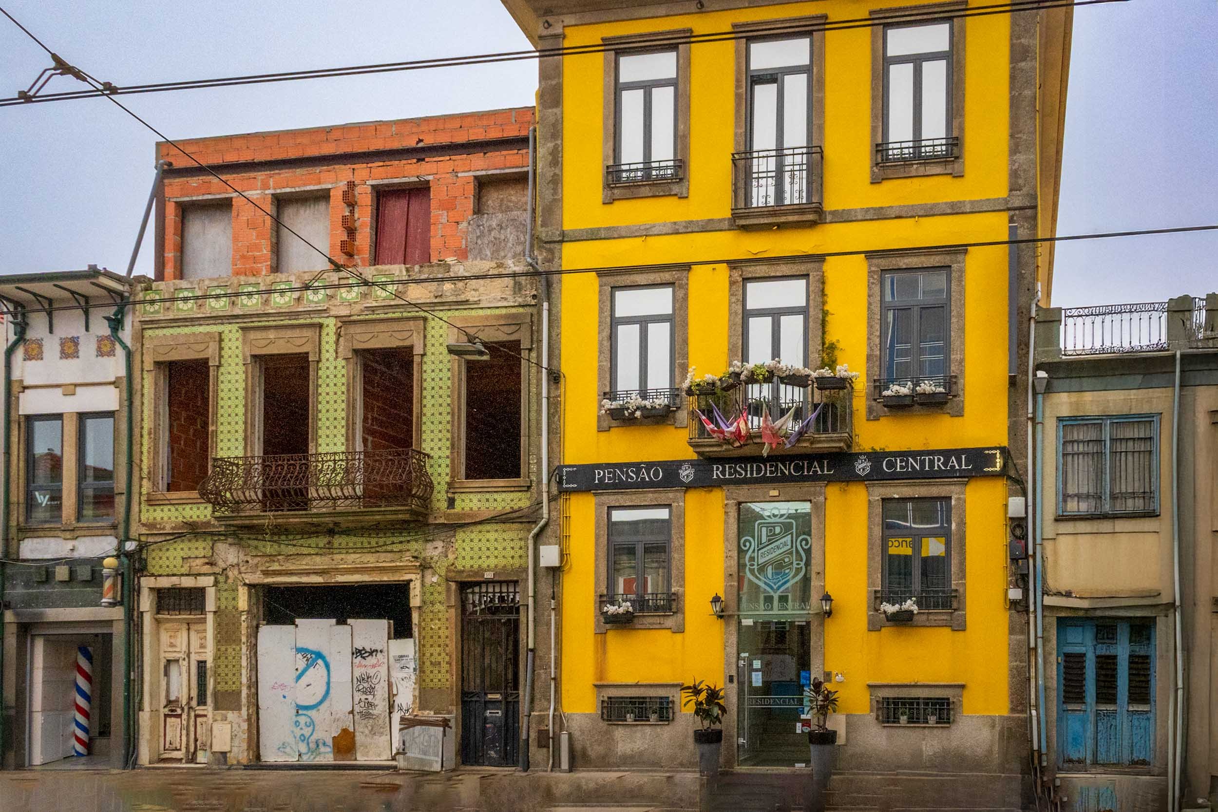 Yellow facade of Pensão Residencial Central guesthouse in Porto"