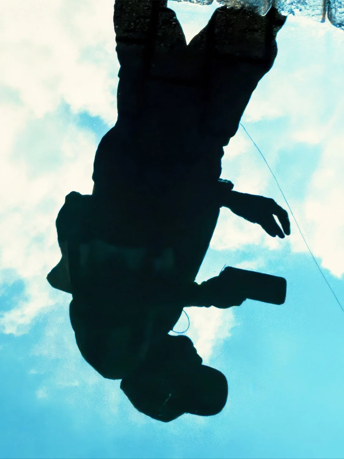 Photographer silhouette puddle reflection blue sky creative photography artistic outdoor portrait image.