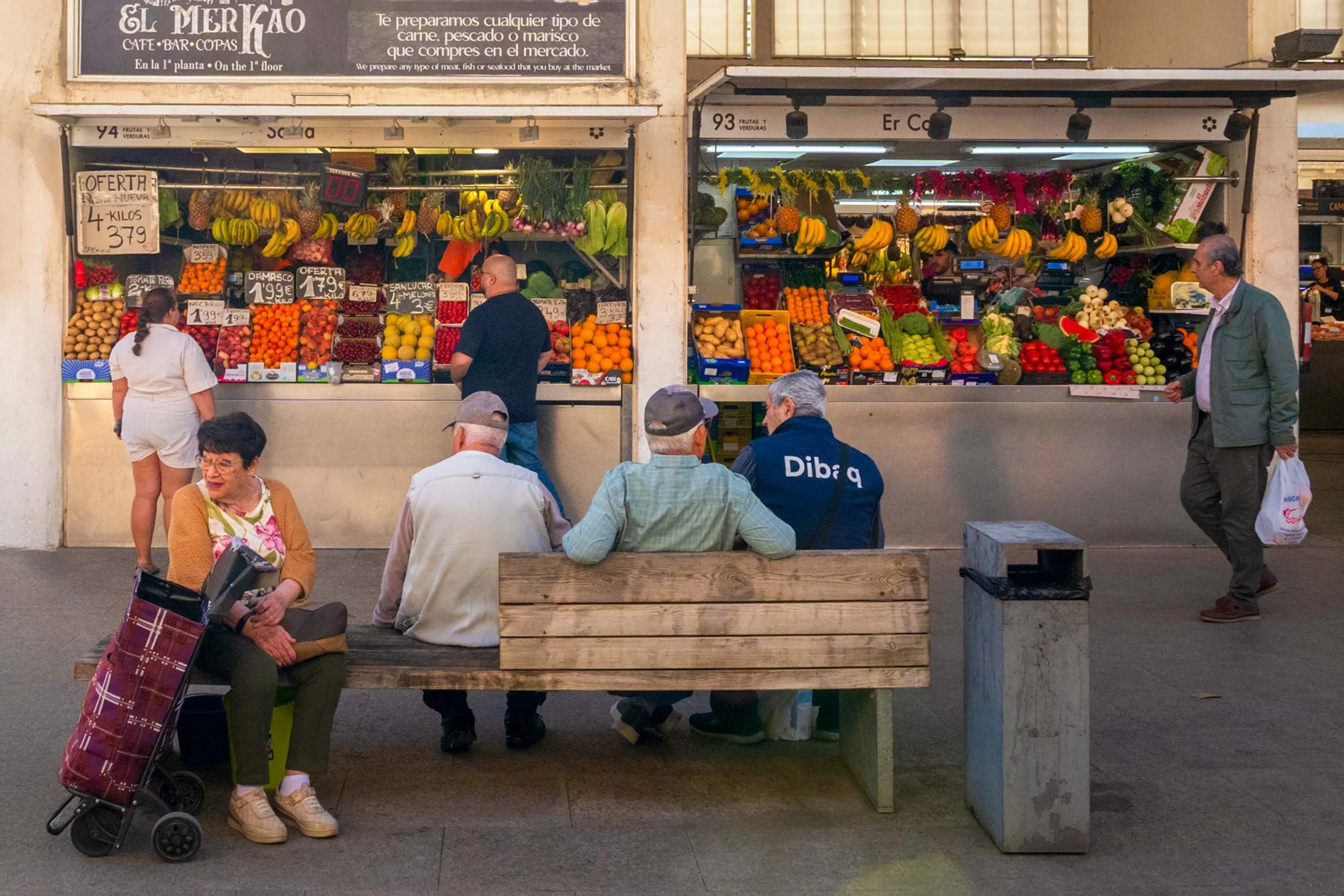 Cadiz Spain indoor market fruit stalls fresh produce vendors local shoppers traditional mercado Spain