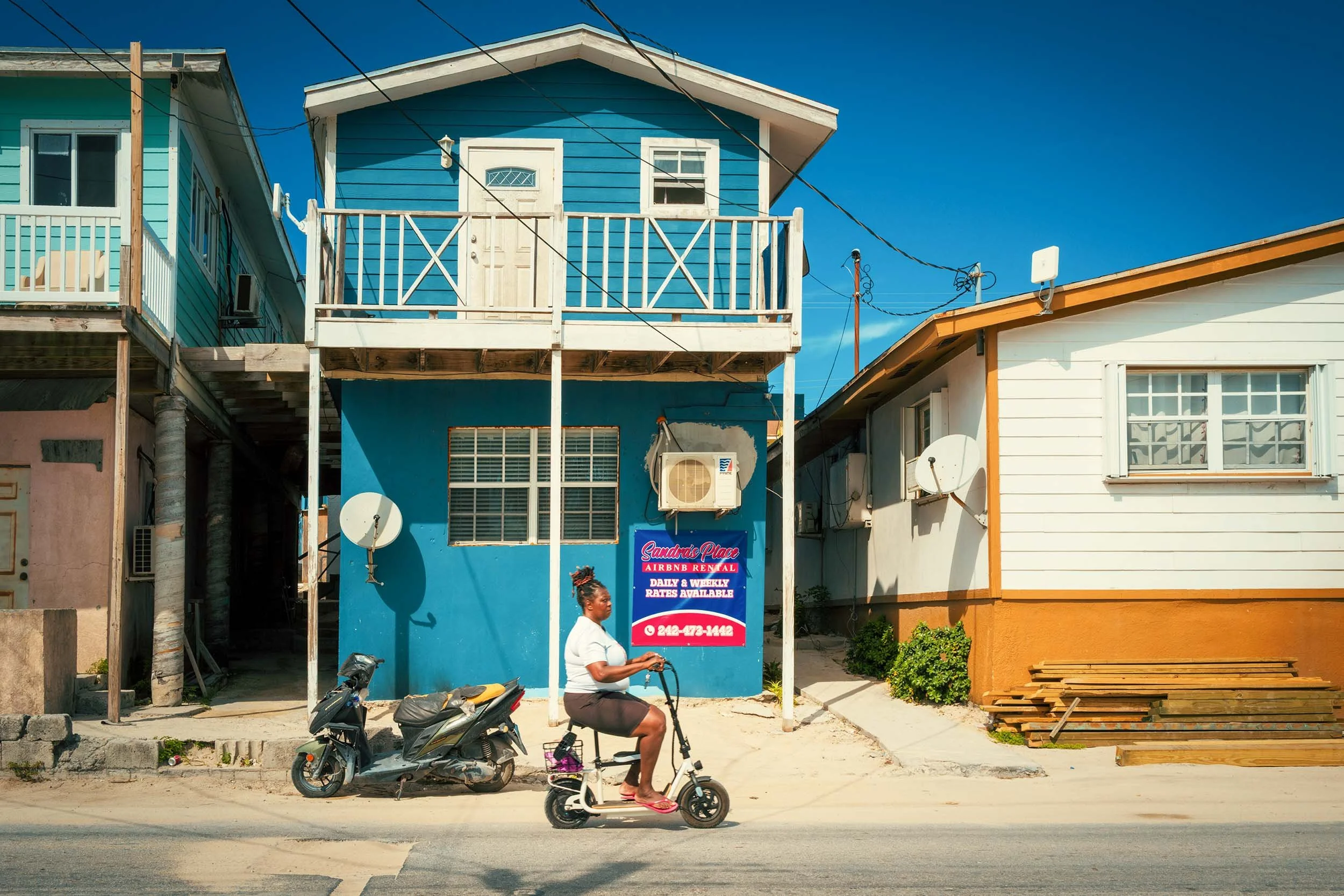 Simple mode of transportation past the wooden houses in Bimini Bahamas