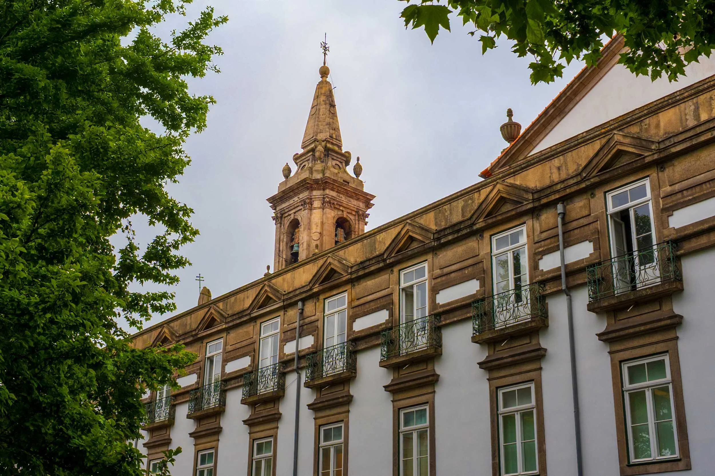 Historic bell tower and classical architecture in Porto, Portugal