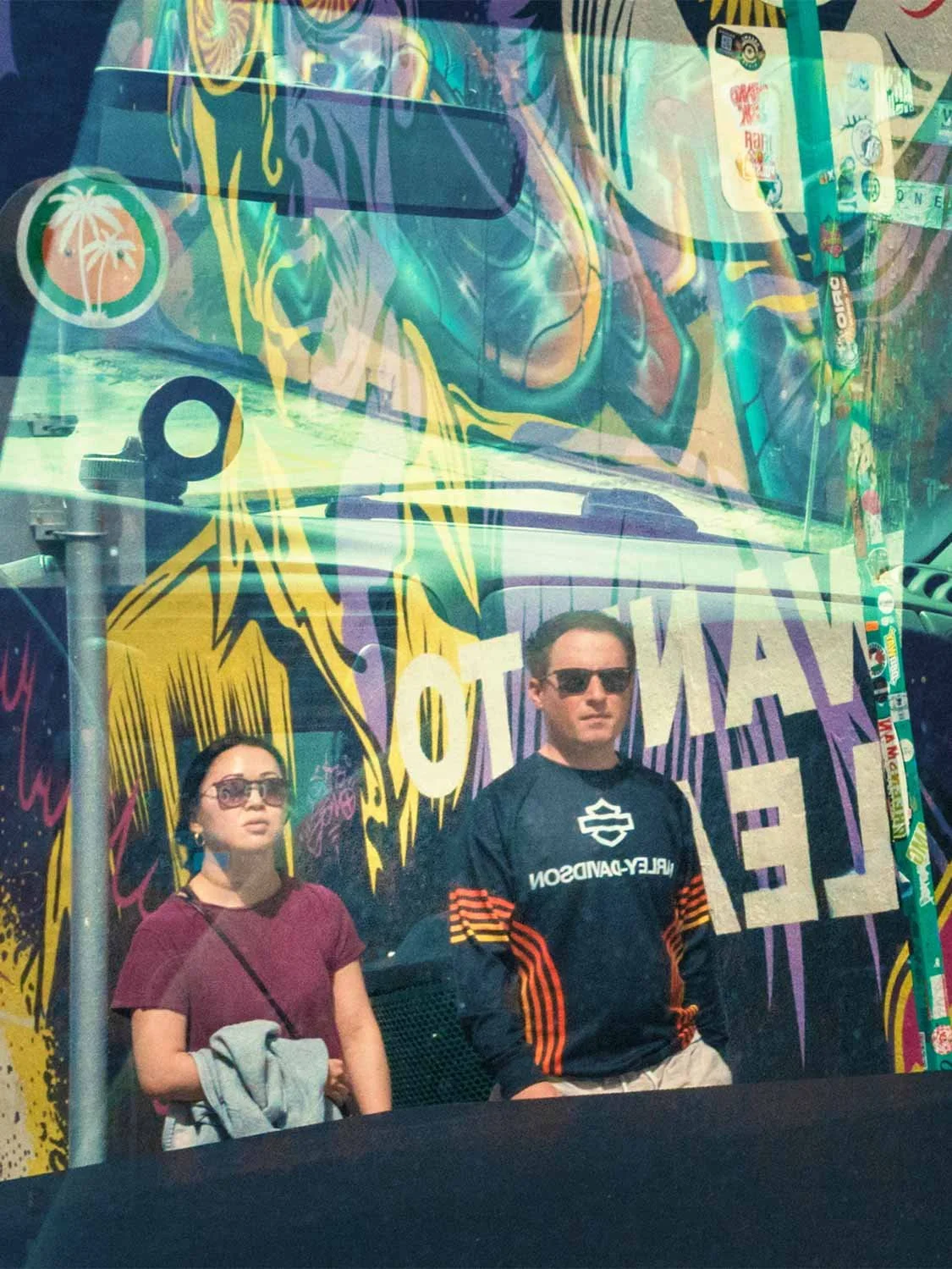 Wynwood Walls street art Miami couple sunglasses graffiti mural colorful urban art district