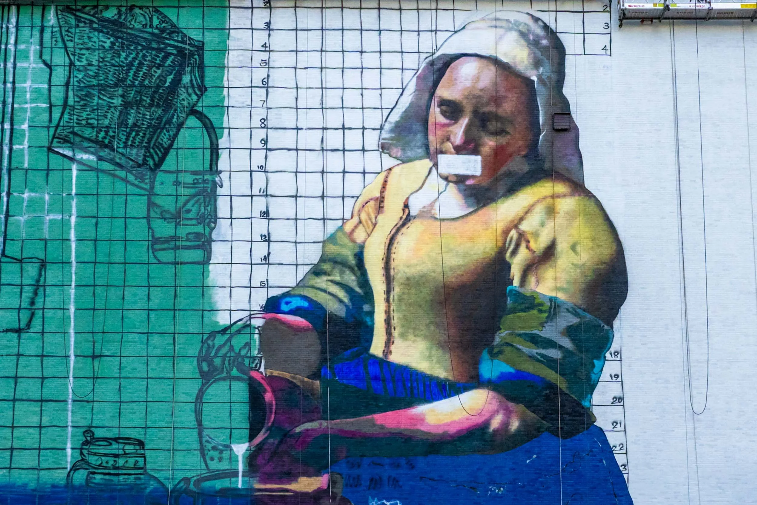 A Milkmaid mural with the numbered grid still visible, tape over her mouth and the pitcher only sketched in