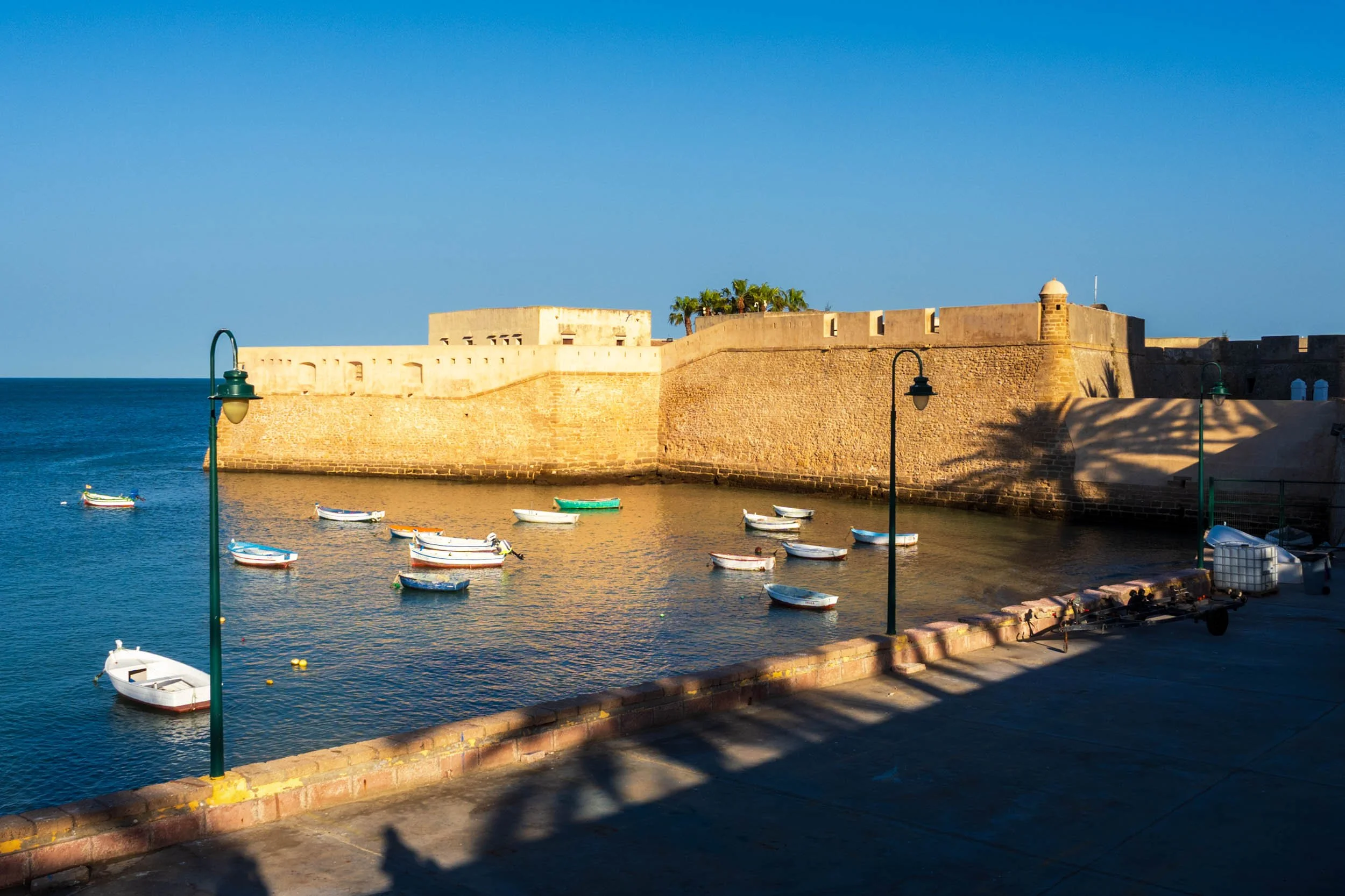 Cadiz Spain castle waterfront historic fort fishing boats Mediterranean harbor old city landmark