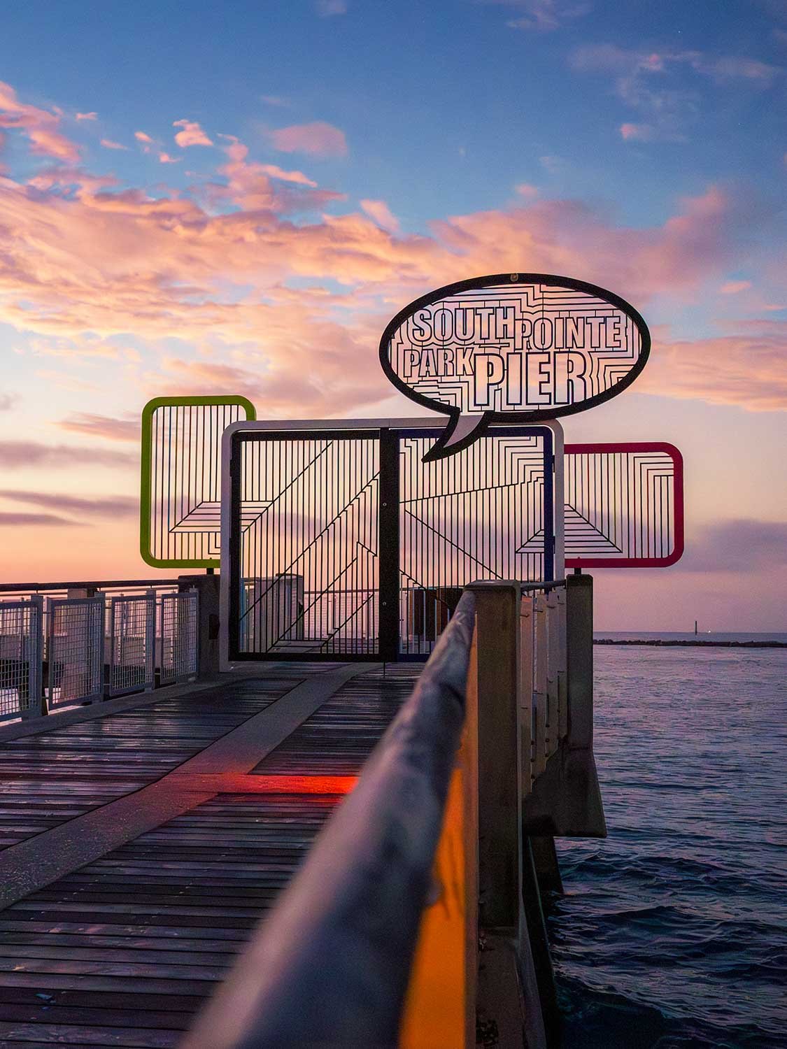 South Pointe Pier at sunrise in South Beach Miami with warm light reflecting on the Atlantic Ocean