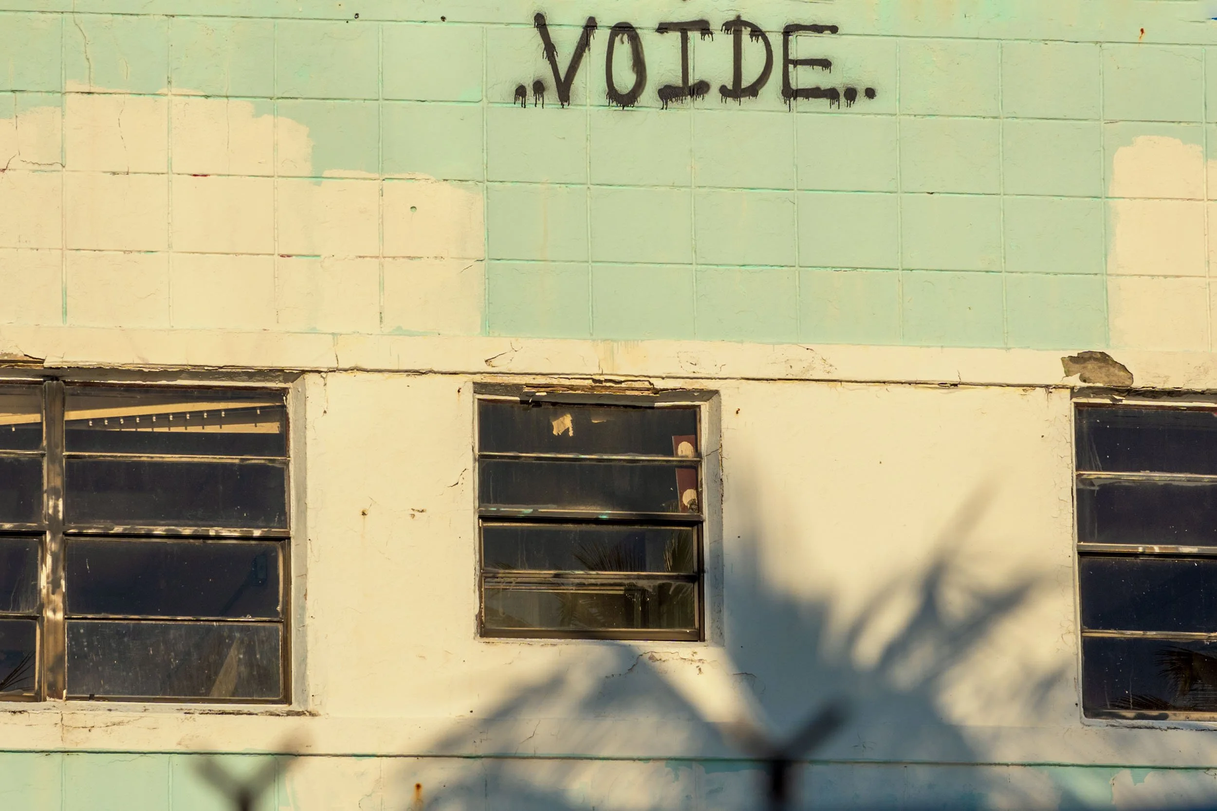 Close-up of VOIDE graffiti tag on the tiled upper wall of 7410 Ocean Terrace, North Beach