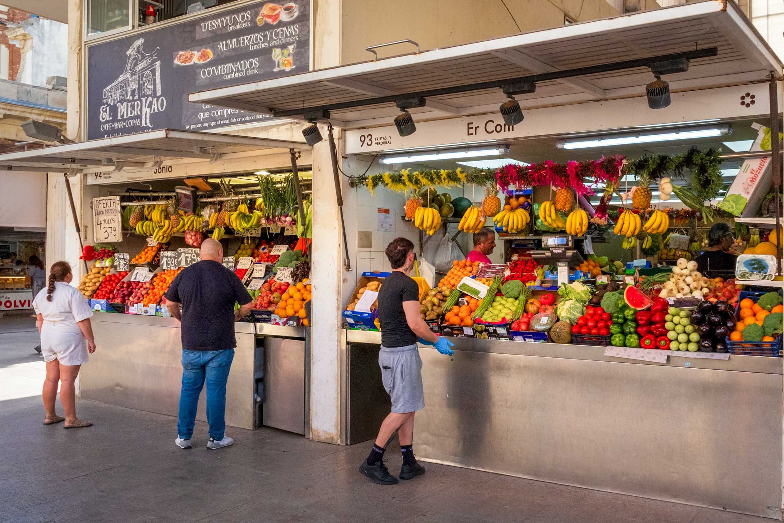 Cadiz Spain market fresh fruit vegetables bananas oranges tomatoes indoor mercado stall local produce shopping