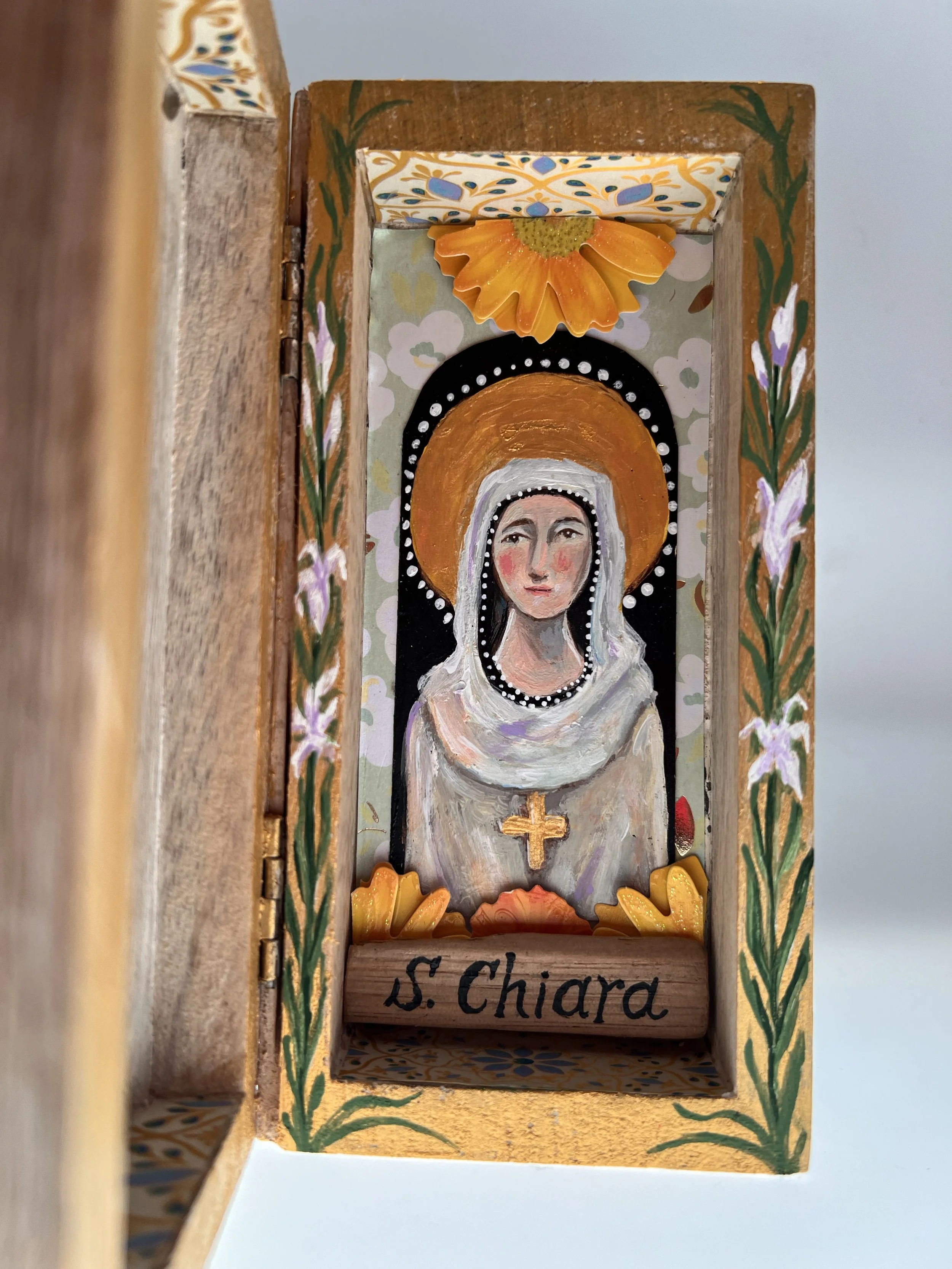 Wood shrine dedicated to Santa Chiara (St. Claire) of Assisi, 2024.