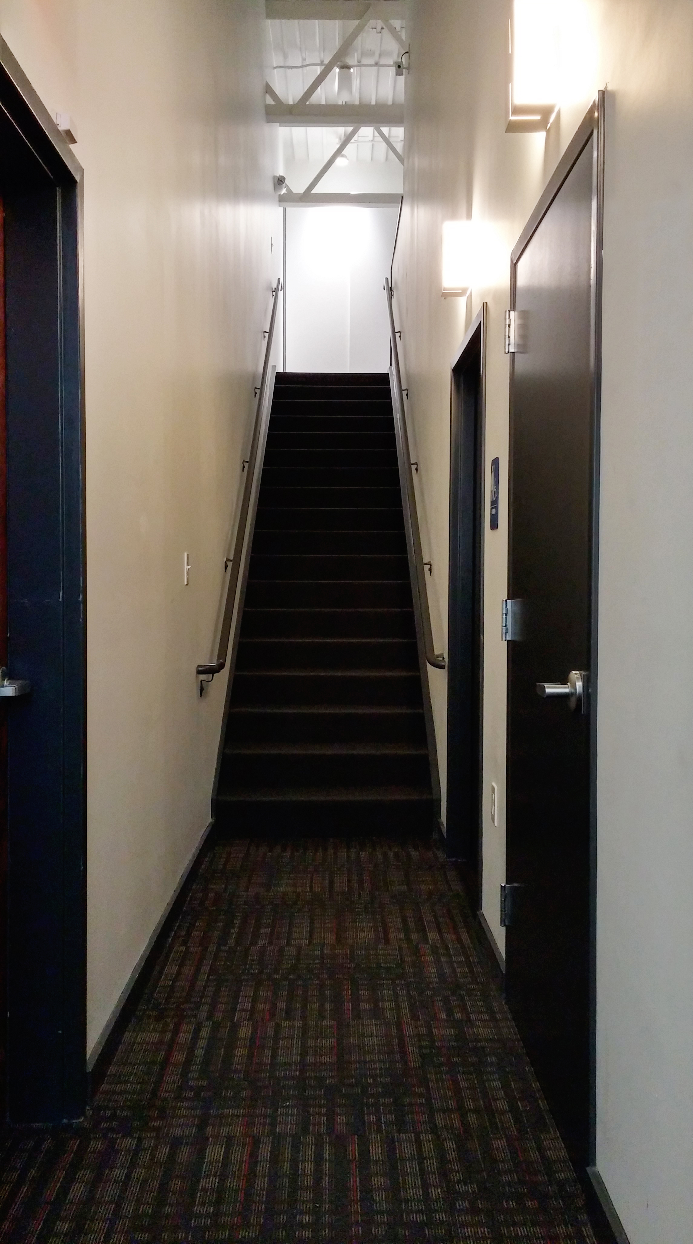 Utility corridor and access stair to Mezzanine above