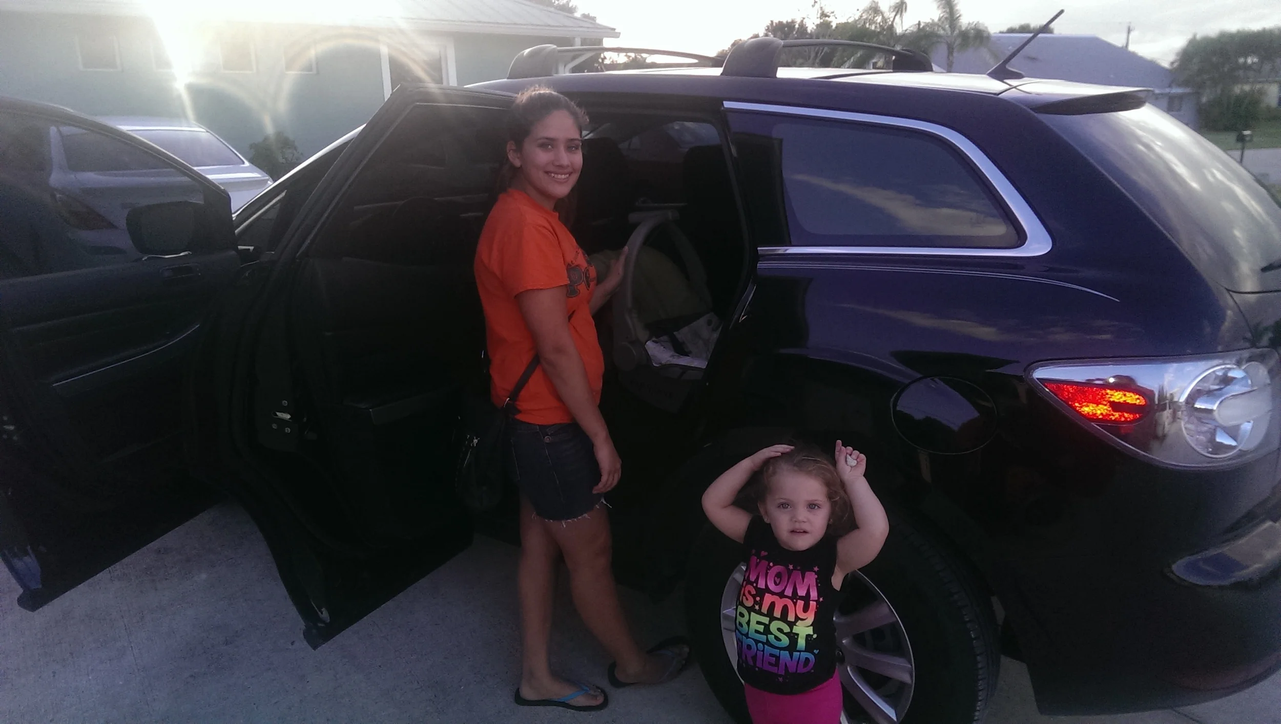 Resident posing with her daughter as they head out in the SUV purchased by SWP 12/2014