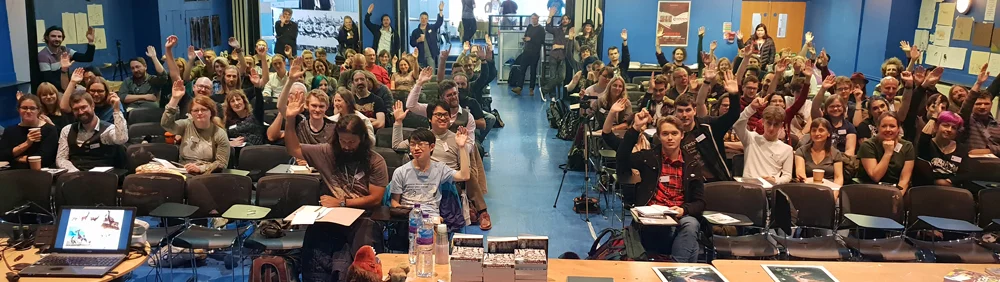A view of the audience, taken from the stage. Note that most people have their hands up. Image: Darren Naish.