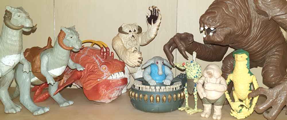 Star Wars creatures. From left to right: tauntauns, opee, wampa, Max Rebo (in ball organ), Sy Snootles, Droopy McCool, Amanaman, rancor. We’ll be talking about some of these creatures below. Image: Darren Naish.