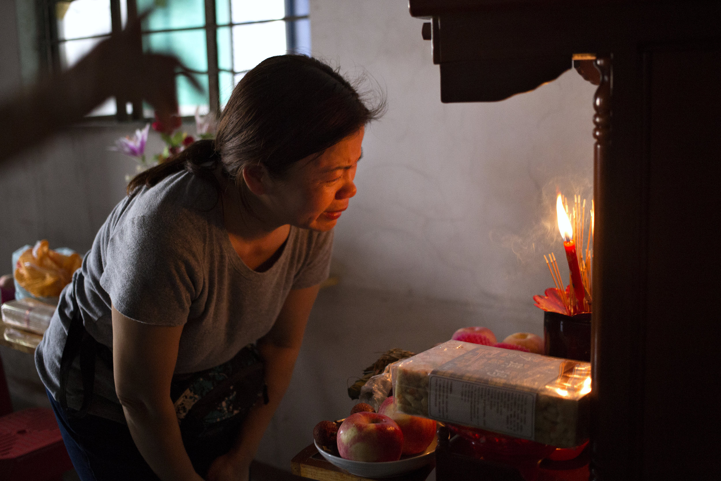  ‭ ‬“Ma, Ba, I’ve come back,” Mother begins to cry as she greets her mom and dad at the altar. Incense, fresh fruit and various pastries were bought beforehand to place as offerings to my grandparents.&nbsp; 