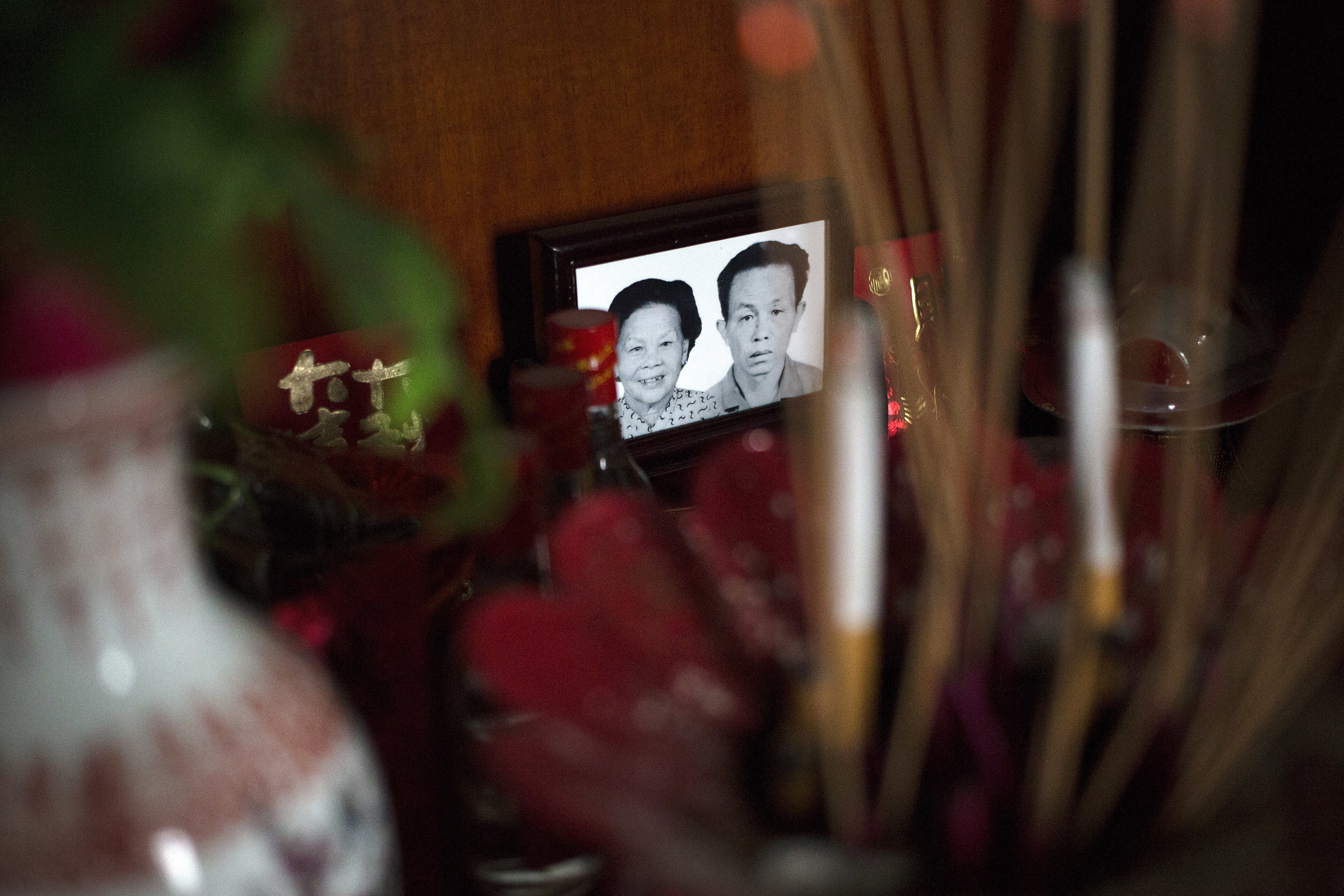 A portrait produced by a digital service specializing in funerary portraits is framed and placed in the middle of the altar. Gongong died in 1994 when I was two years old and Popo died when I was 22. 