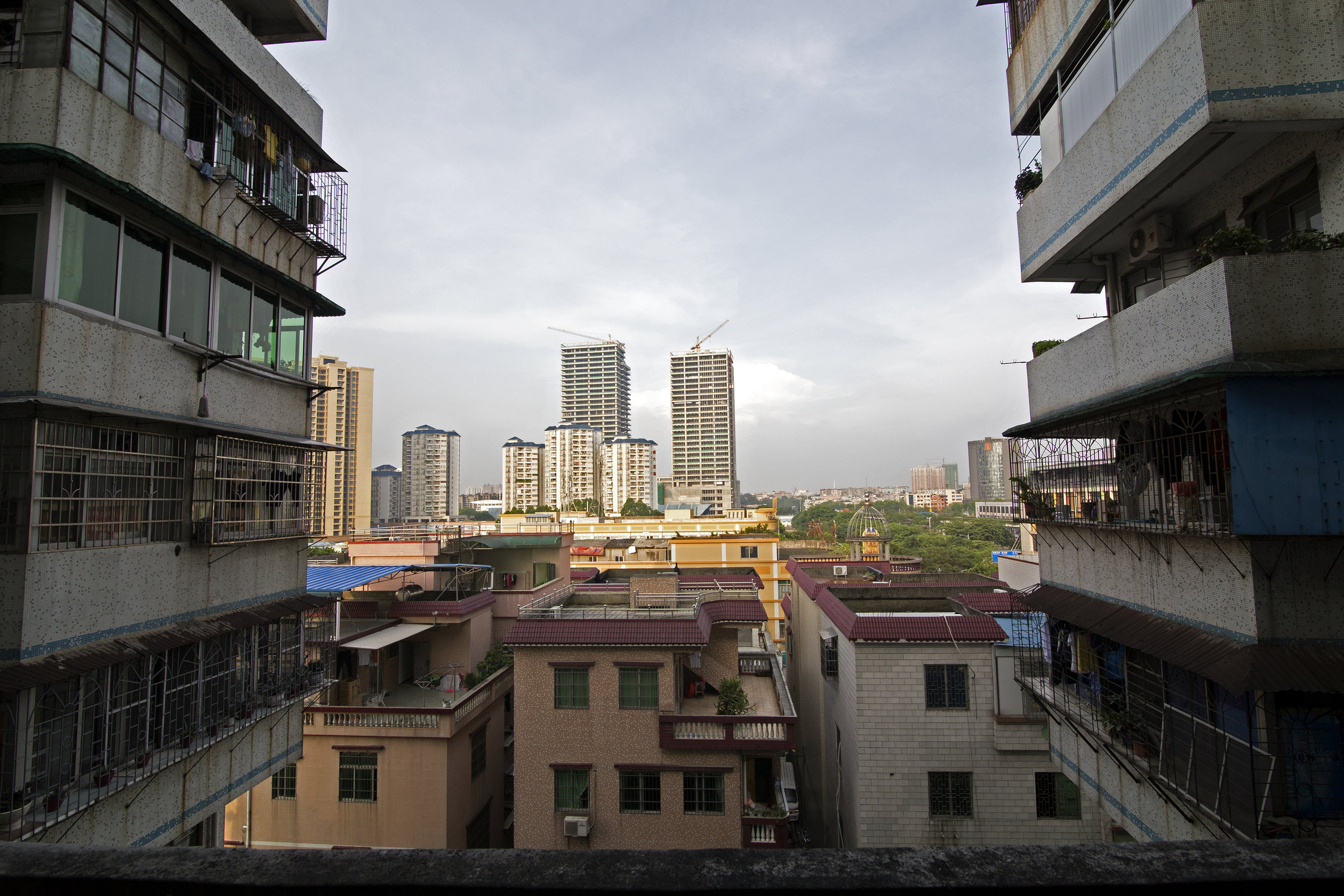 The view from the apartment’s balcony opens up to Guangzhou’s continuously changing landscape. “The government tore down the building we originally lived in and relocated us to these apartments. The view used to be of farm land for as far as you cou