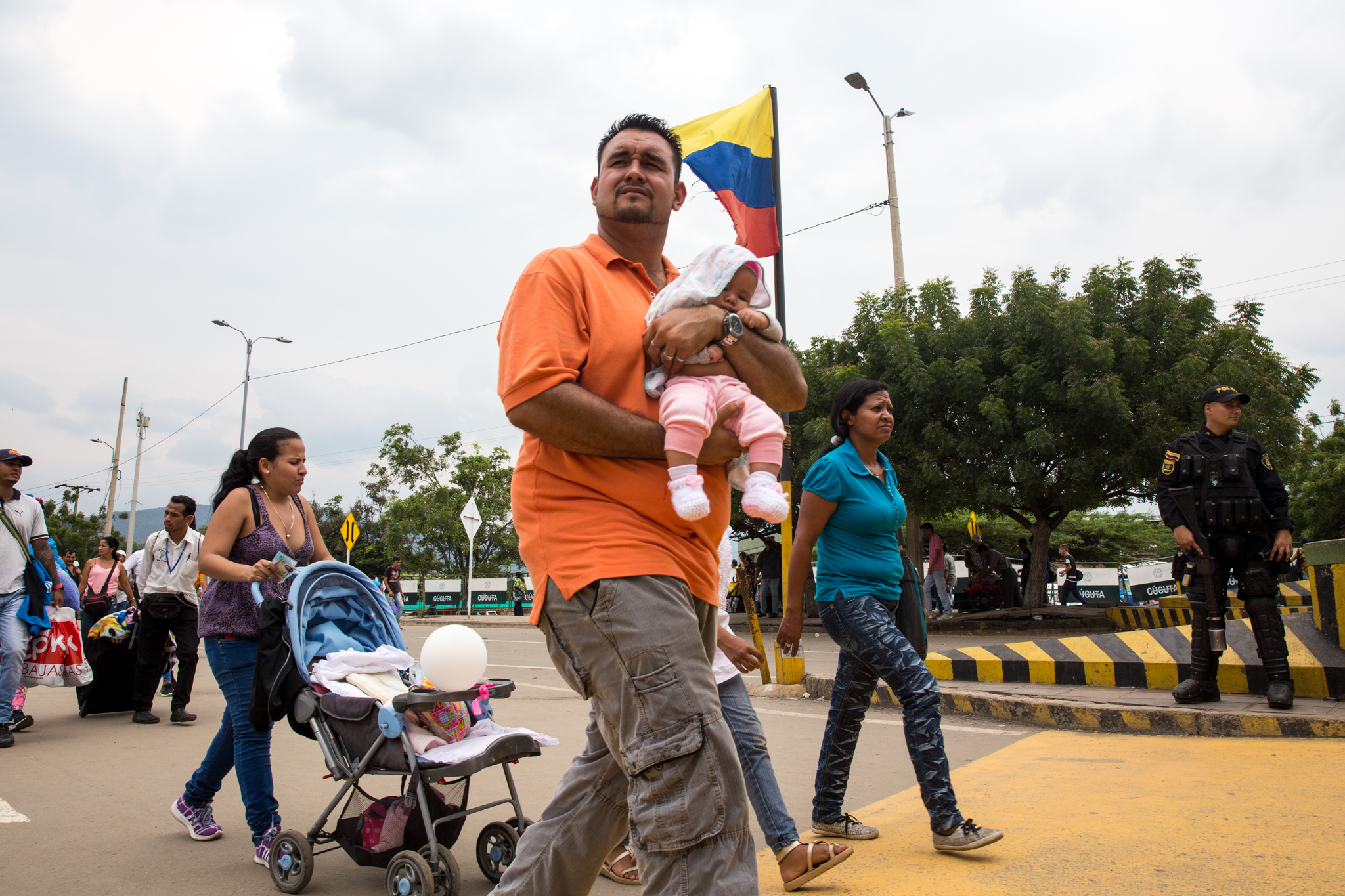 A family crosses into Colombia from Venezuela at the Simon Bolivar international bridge in Cúcuta on April 4, 2018
