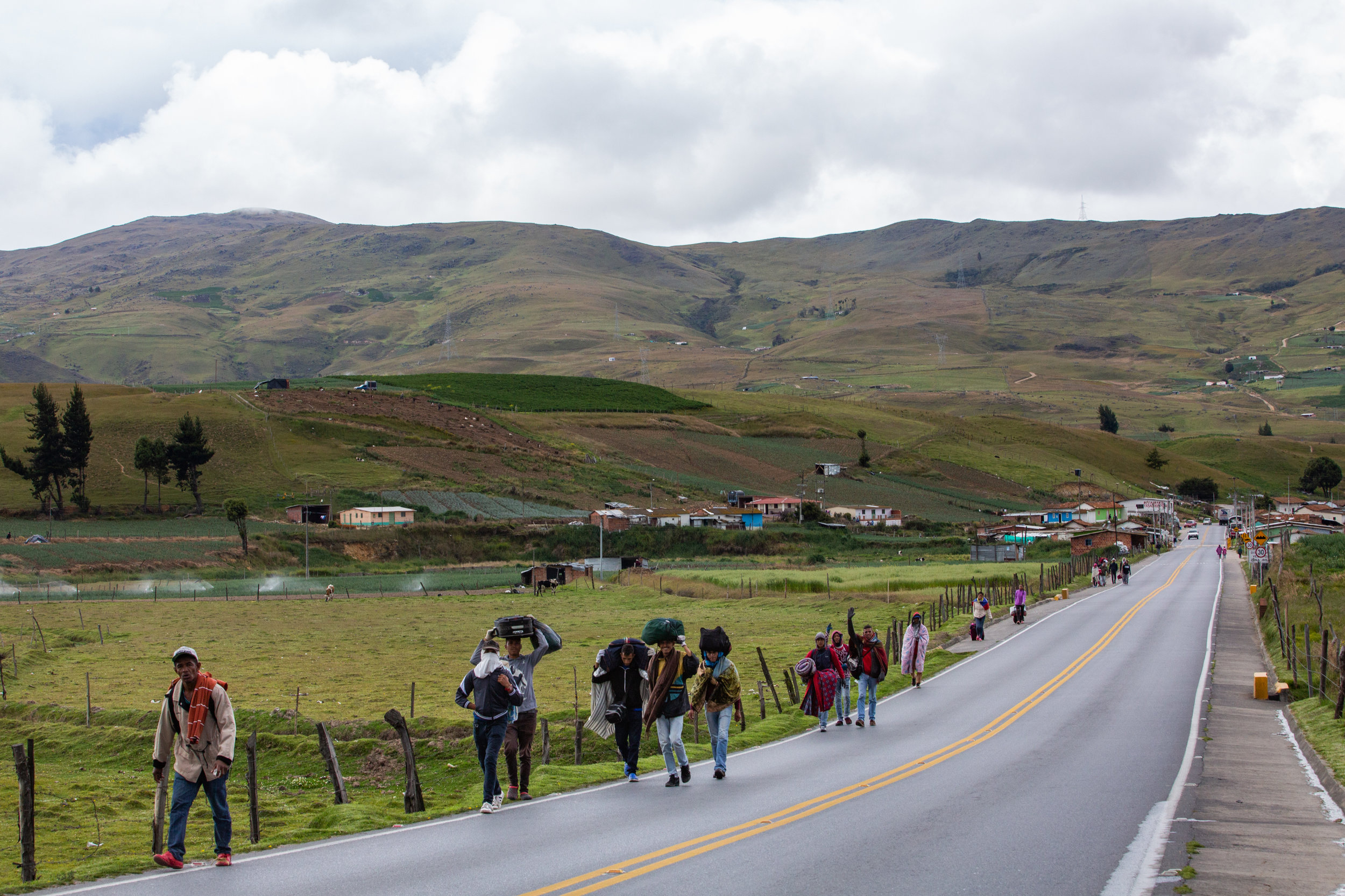 Venezuelan migrants travel on foot along a highway through the paramo de Berlin in the Andean highlands of Colombia.