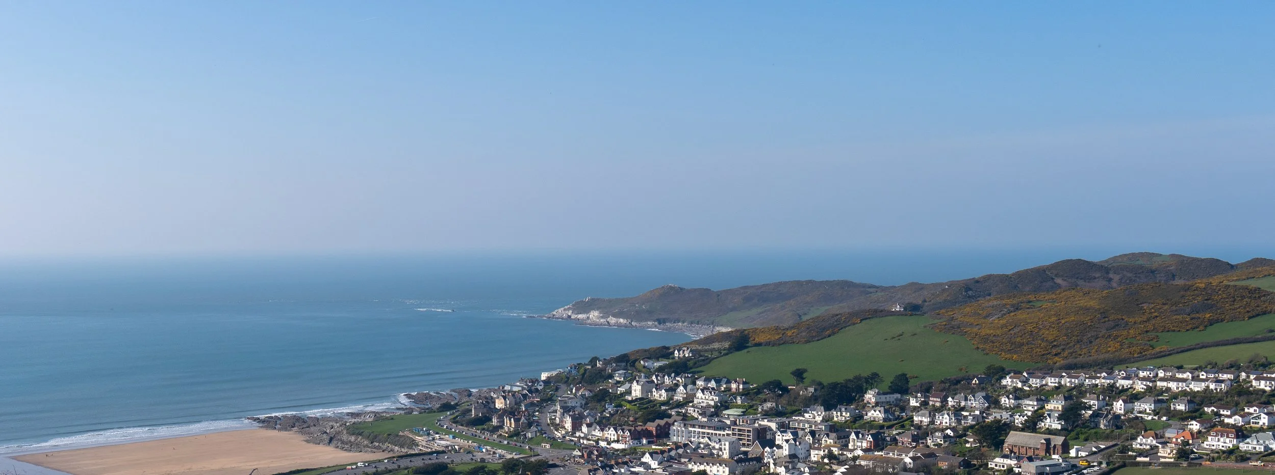 2026-03-20_wide-panorama-of-bay-and-village.jpg